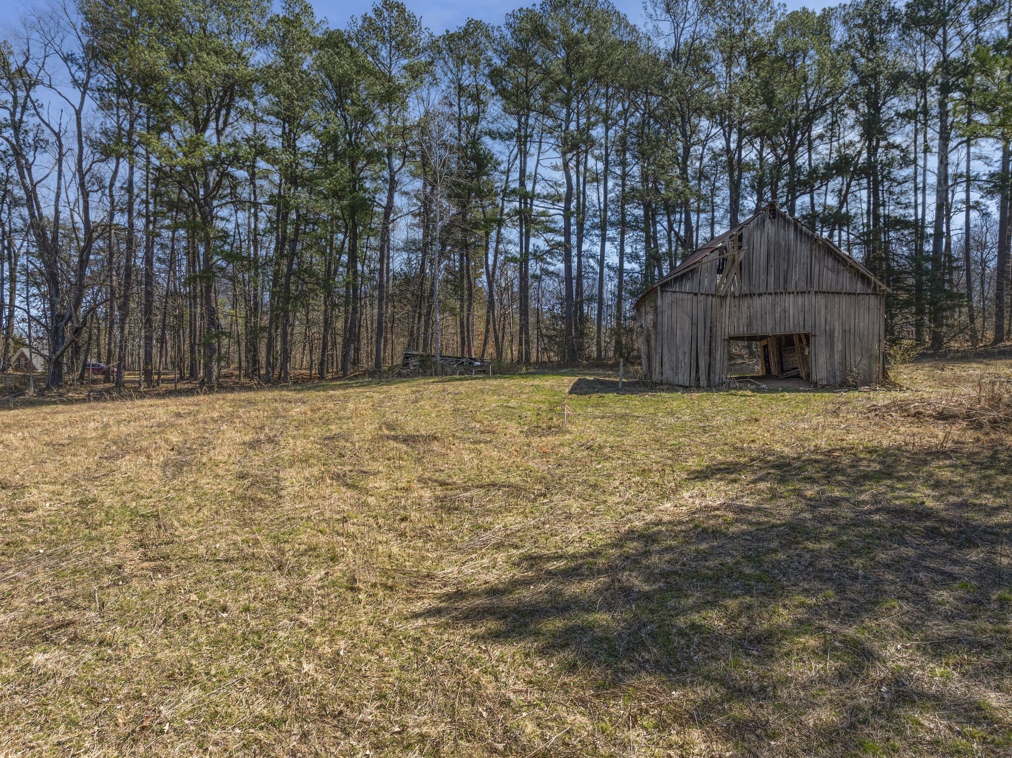 0 Spencer Mill Road Burns, TN 37029 - Photo 24 of 26 a large house with a trees in the background