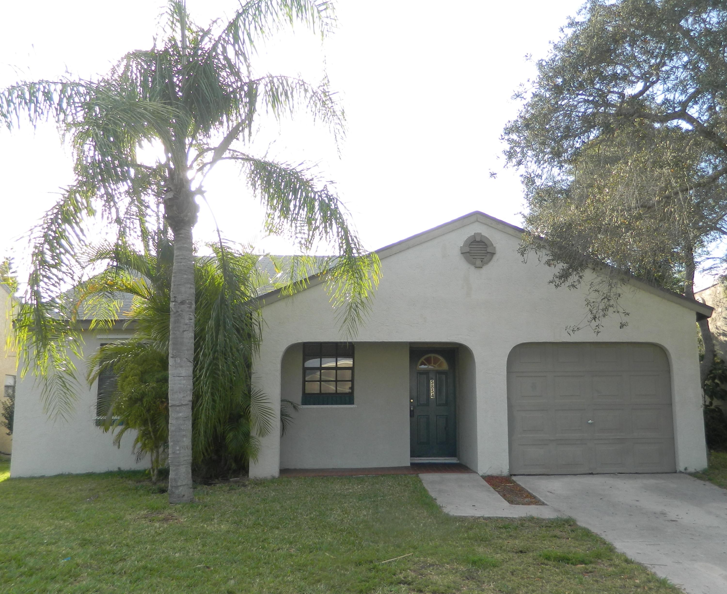 5854 Southeast Mitzi Lane Stuart, FL 34997 - Photo 1 of 18 Front