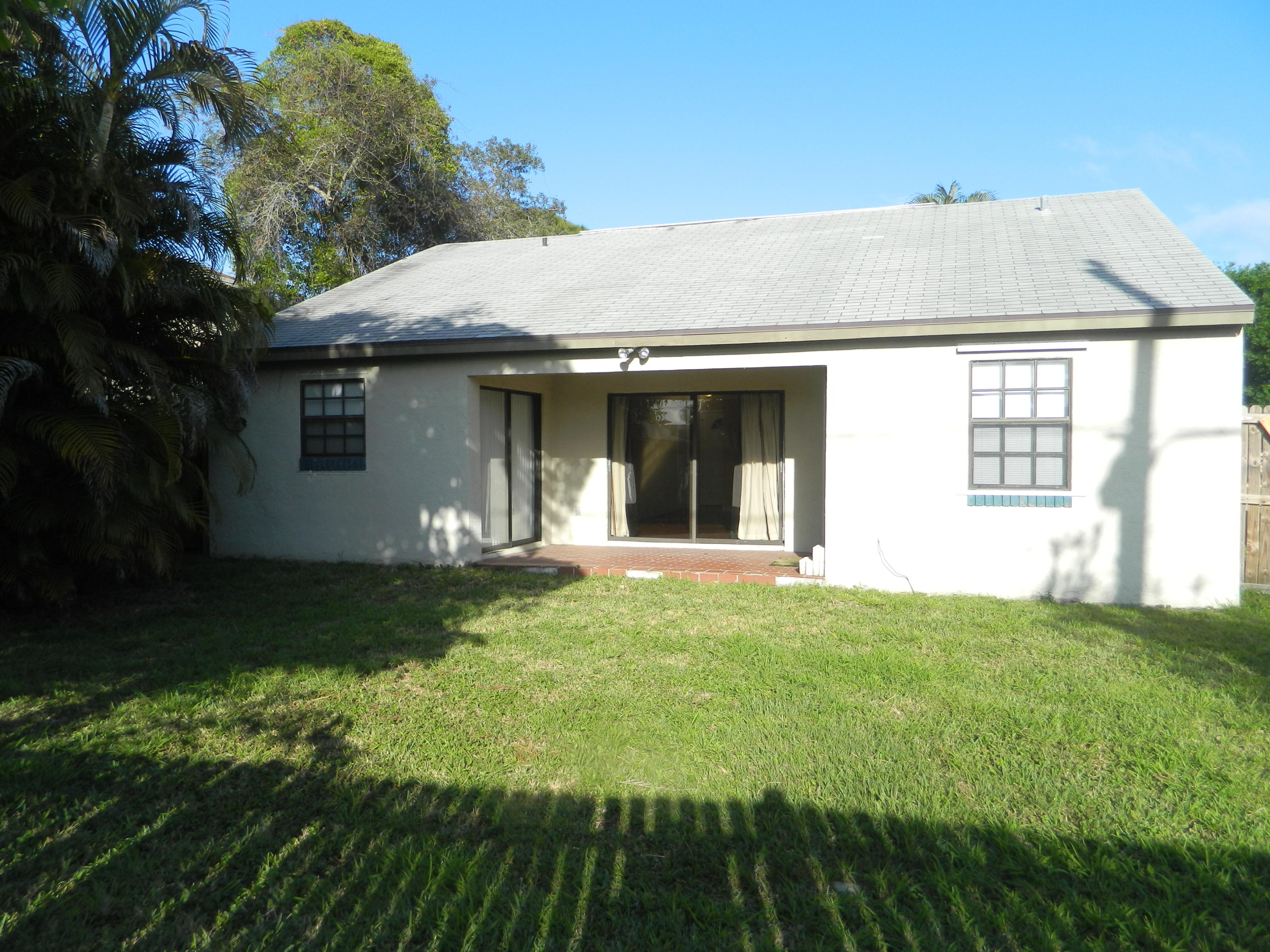 5854 Southeast Mitzi Lane Stuart, FL 34997 - Photo 15 of 18 Exterior back