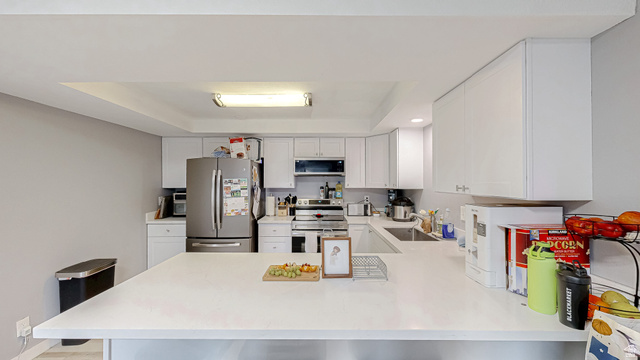 630 1100 West Provo, UT 84601 - Photo 3 of 64 Modern kitchen featuring white cabinetry and light countertops