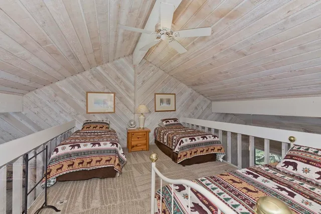 a bedroom with furniture and a chandelier