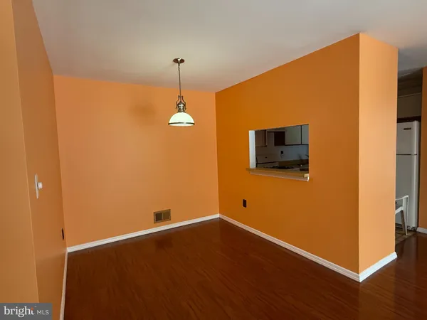 a view of a livingroom with wooden floor
