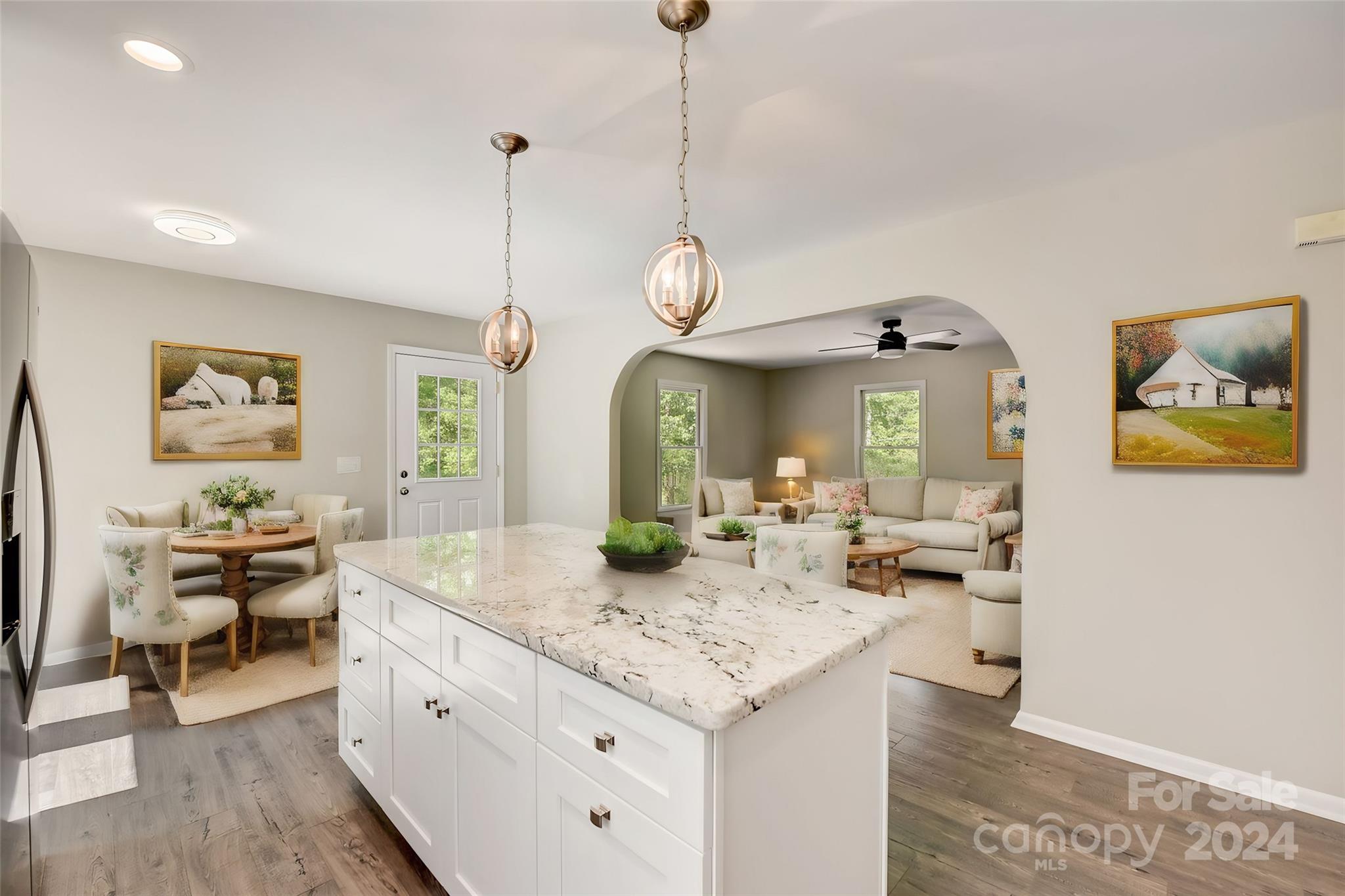 16218 Barbee Road Stanfield, NC 28163 - Photo 12 of 48 a living room with fireplace furniture and a chandelier