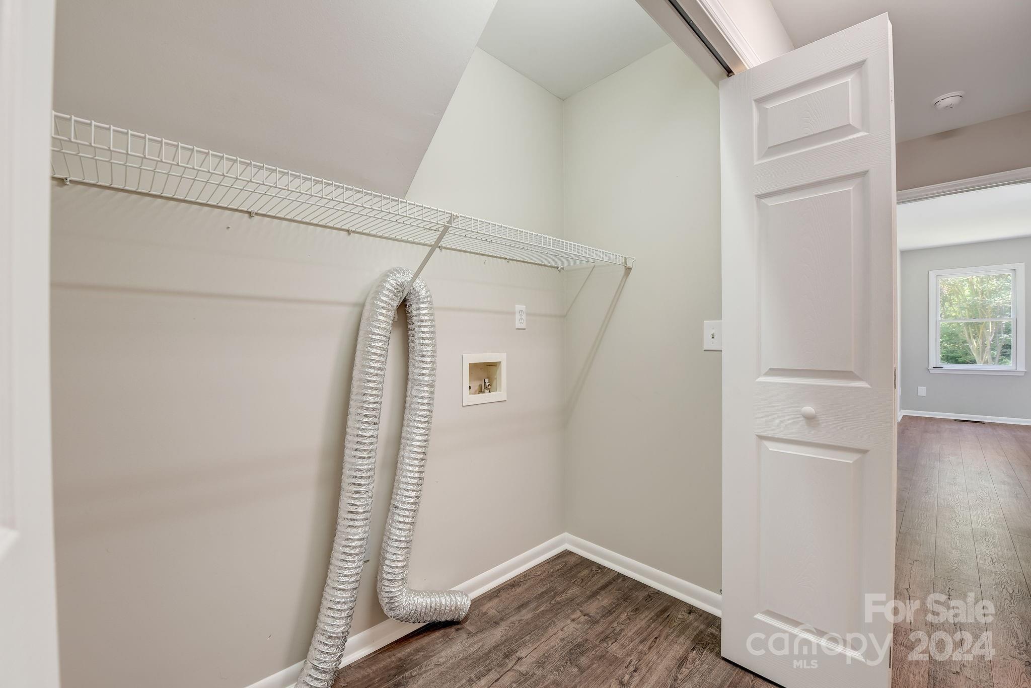16218 Barbee Road Stanfield, NC 28163 - Photo 17 of 48 an empty room with wooden floor and windows