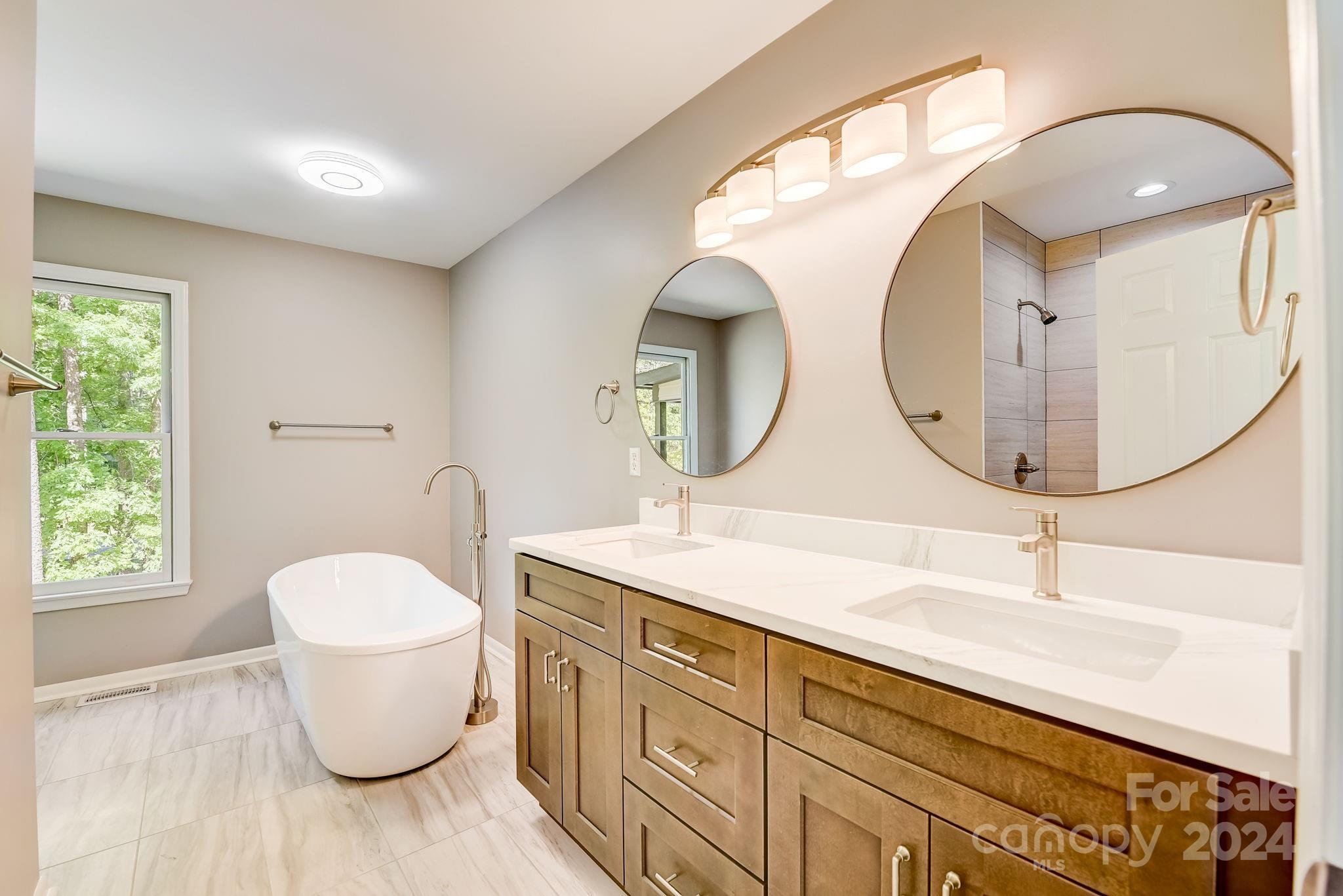16218 Barbee Road Stanfield, NC 28163 - Photo 23 of 48 a bathroom with a toilet a sink and a mirror