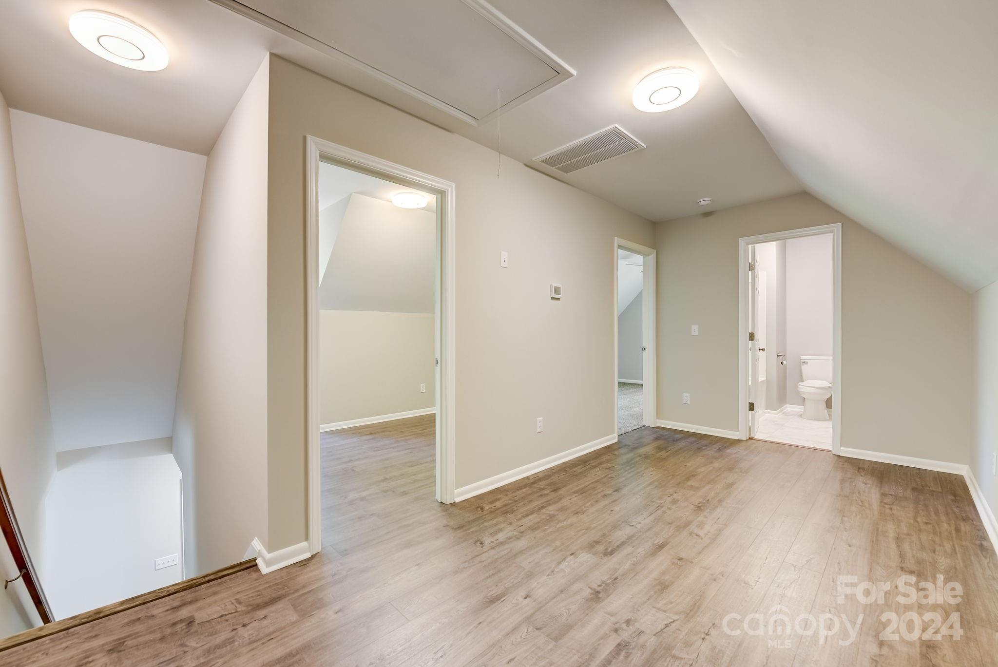 16218 Barbee Road Stanfield, NC 28163 - Photo 25 of 48 wooden floor in an empty room with wooden floor
