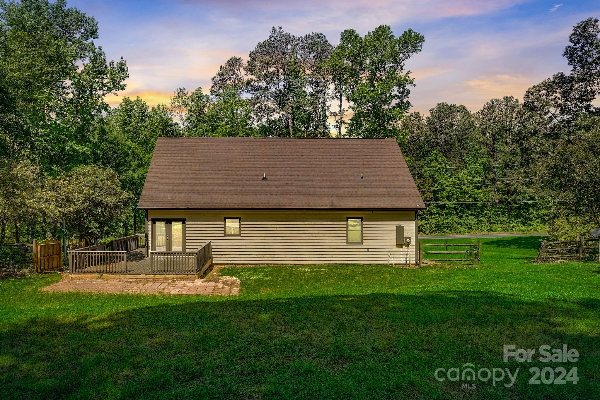 16218 Barbee Road Stanfield, NC 28163 - Photo 3 of 48 a front view of a house with a yard