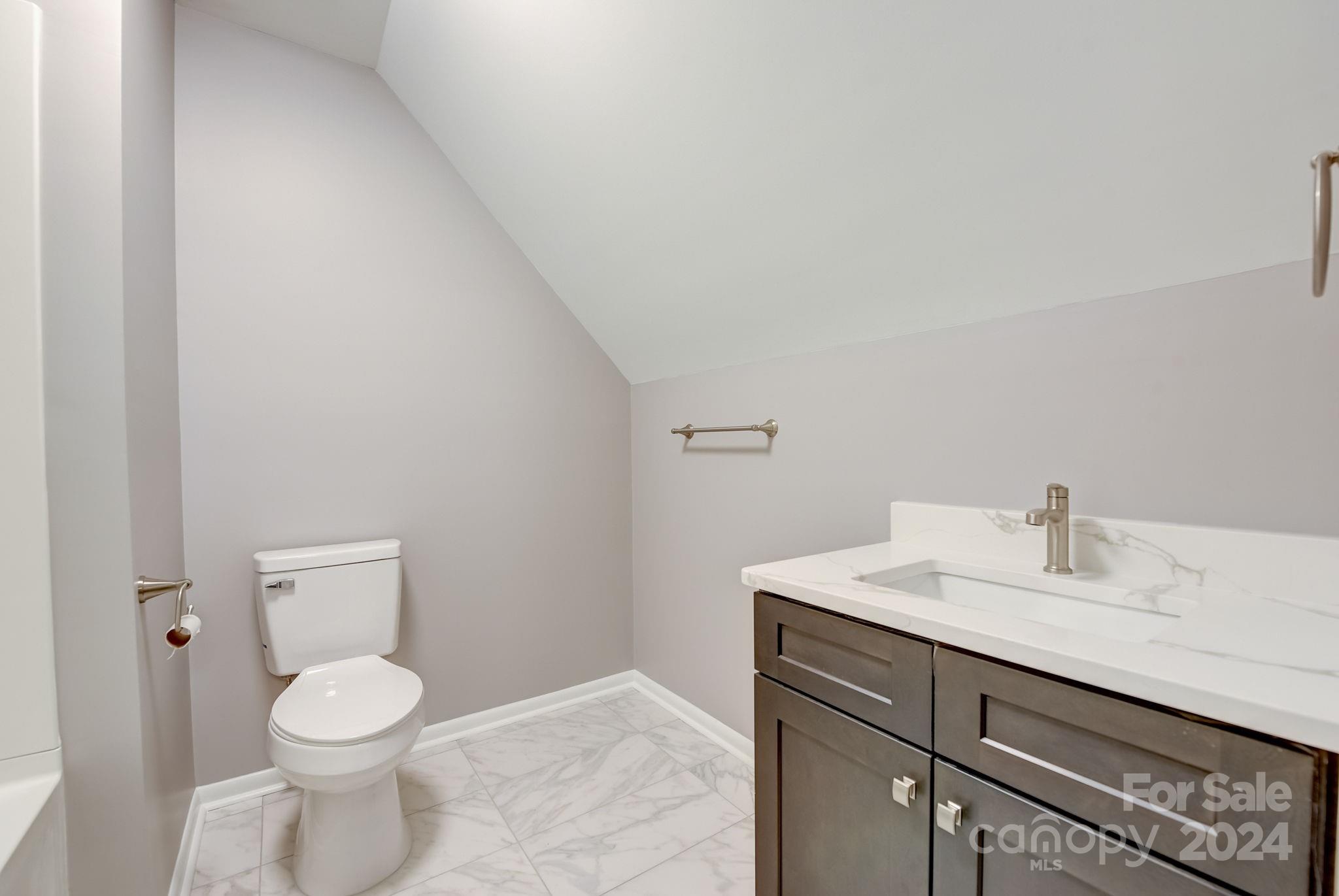 16218 Barbee Road Stanfield, NC 28163 - Photo 31 of 48 a bathroom with a toilet sink and mirror
