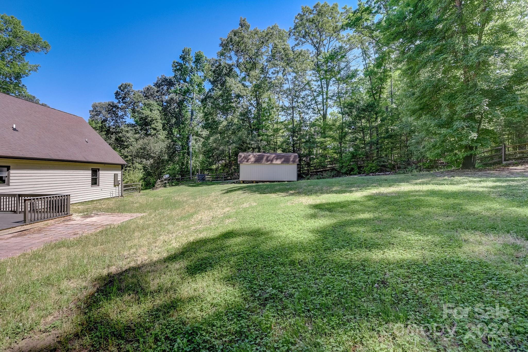 16218 Barbee Road Stanfield, NC 28163 - Photo 36 of 48 a view of a house with a yard