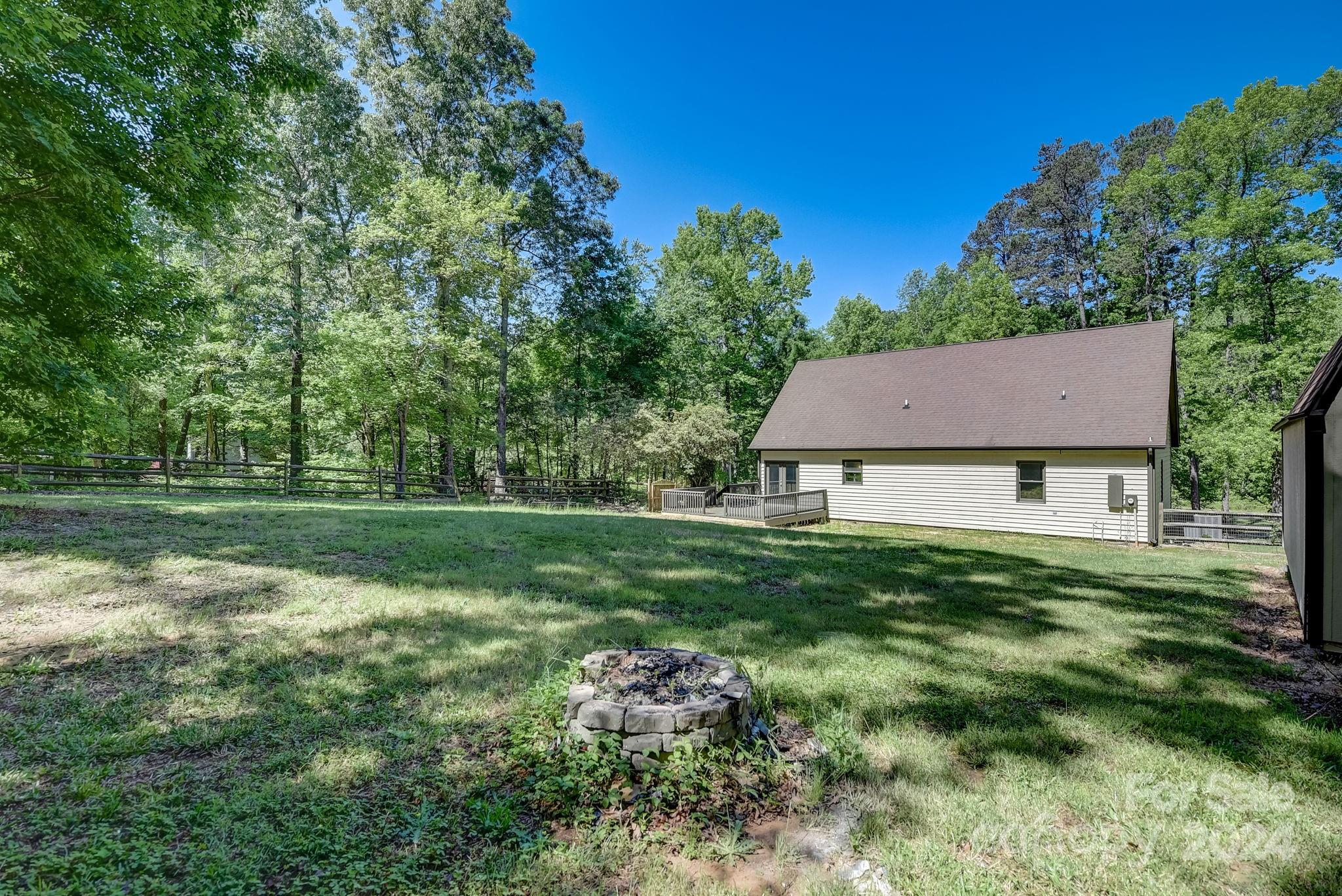 16218 Barbee Road Stanfield, NC 28163 - Photo 39 of 48 a view of a house with a yard
