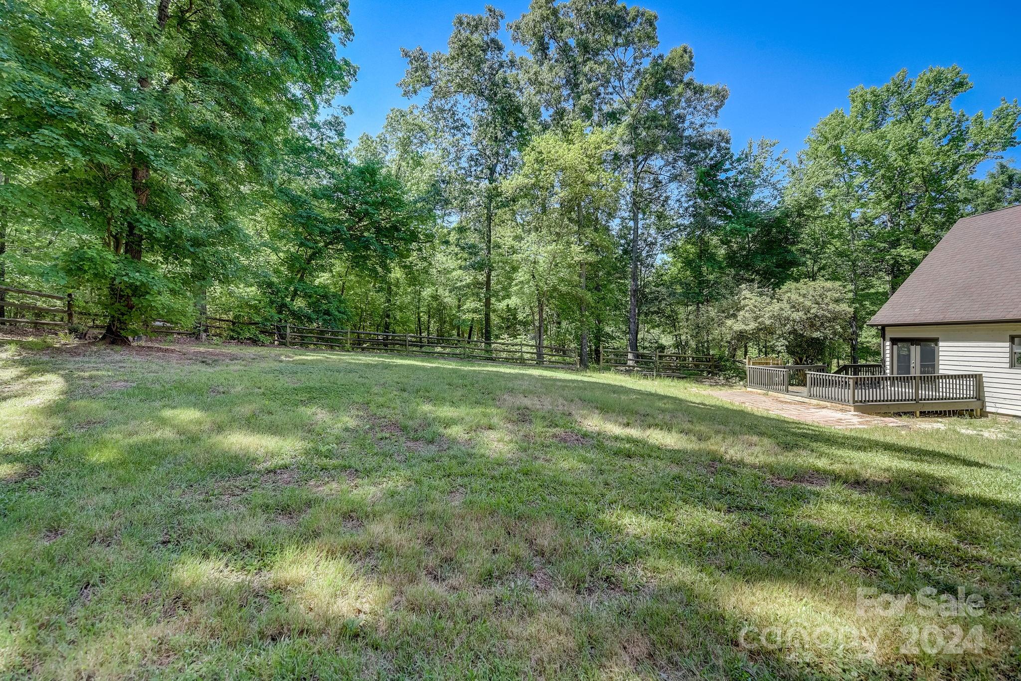 16218 Barbee Road Stanfield, NC 28163 - Photo 40 of 48 a view of a green field with trees in the background