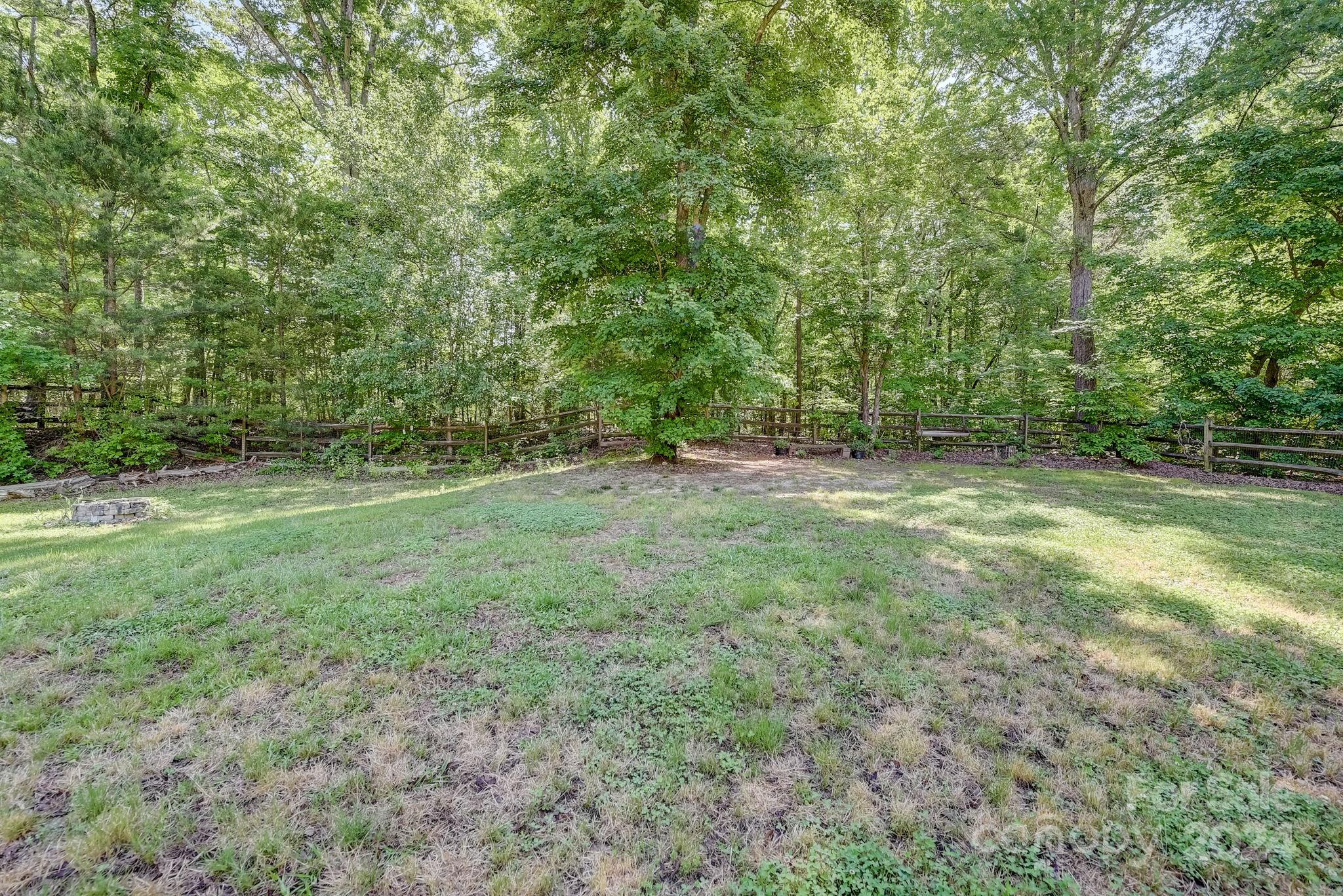 16218 Barbee Road Stanfield, NC 28163 - Photo 41 of 48 a view of outdoor space with trees all around