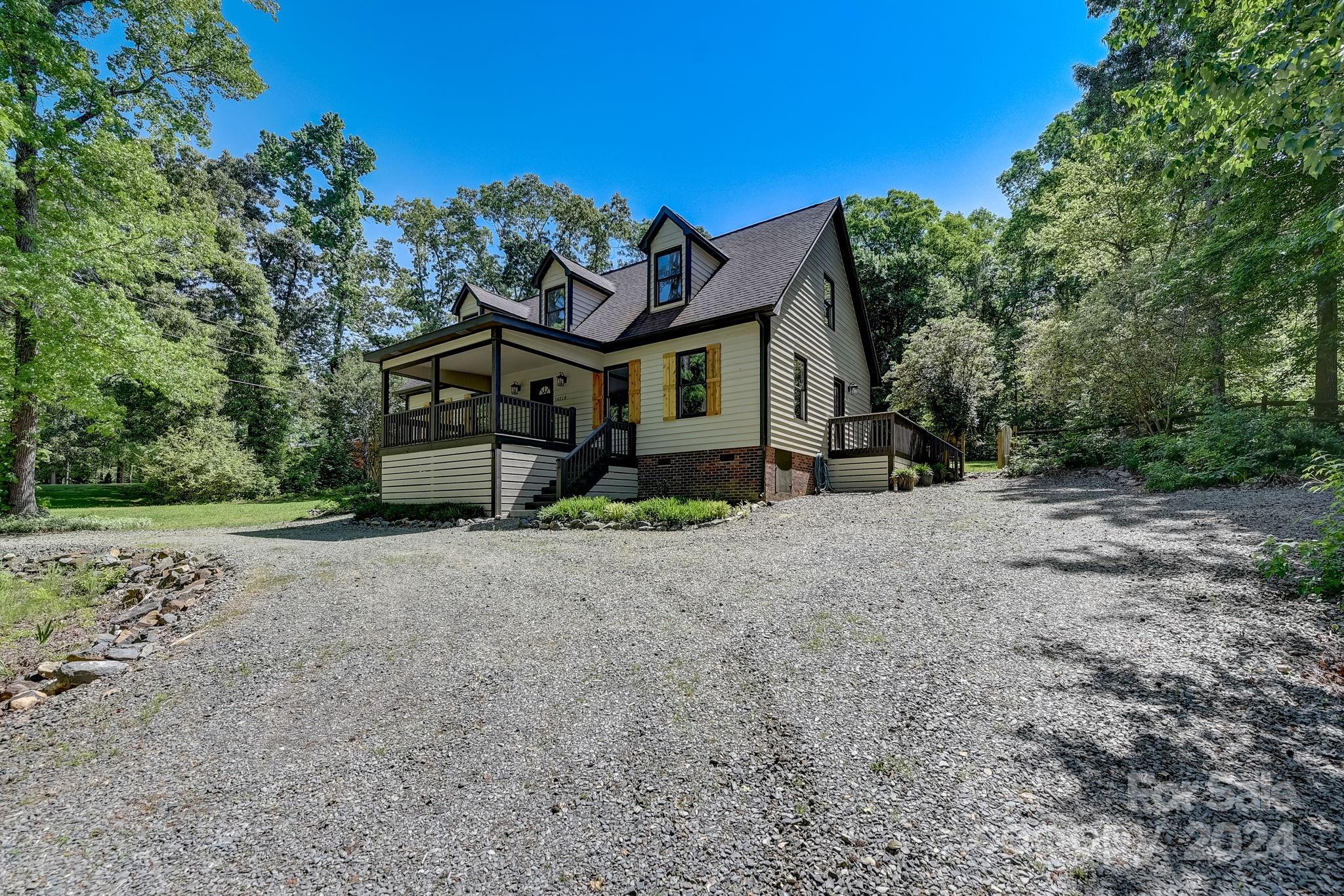 16218 Barbee Road Stanfield, NC 28163 - Photo 43 of 48 a view of a house with a yard