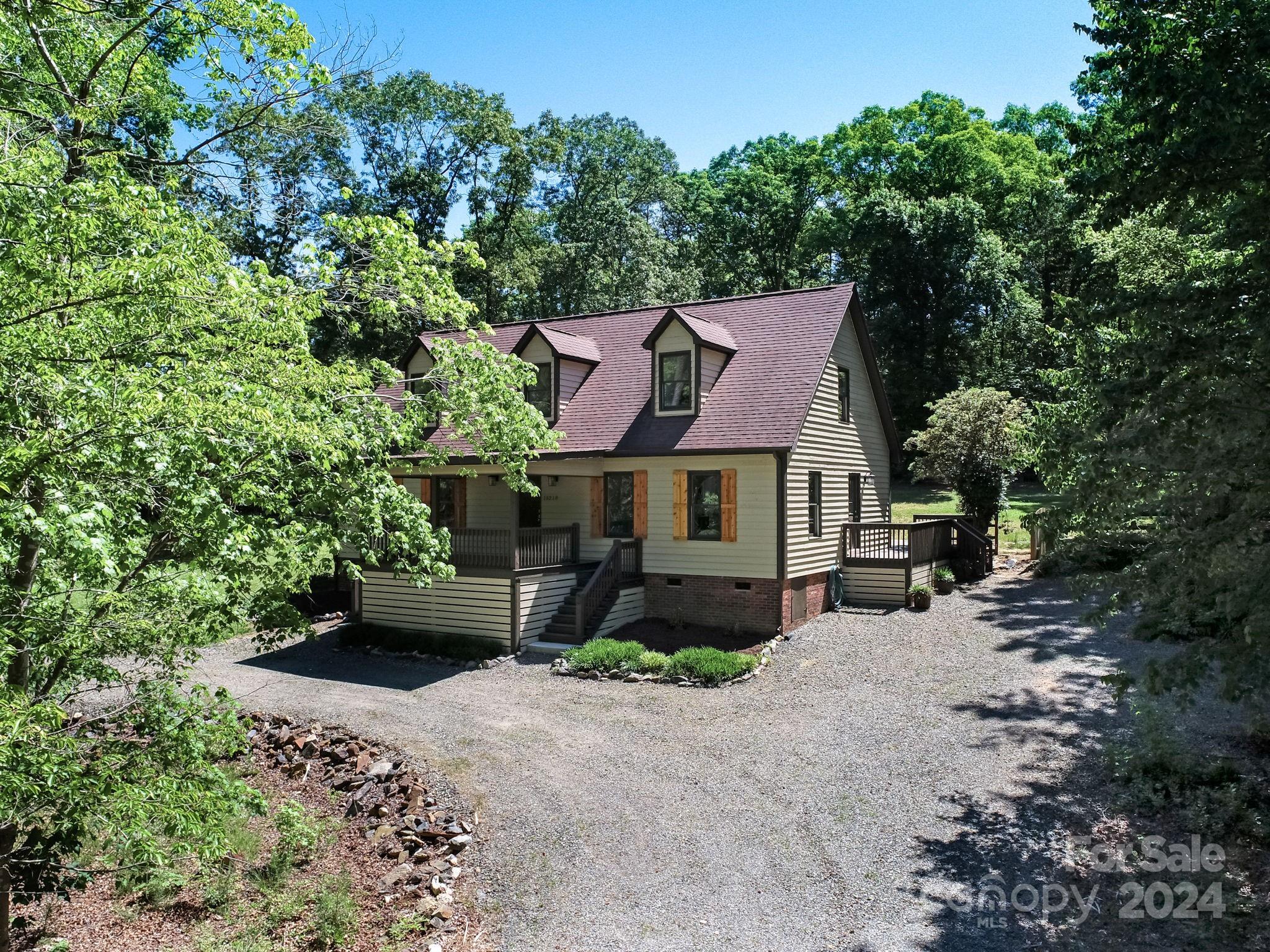 16218 Barbee Road Stanfield, NC 28163 - Photo 5 of 48 an aerial view of a house with yard and tree s