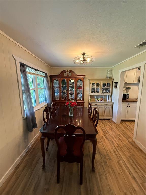 8384 West FM 545 Blue Ridge, TX 75424 - Photo 13 of 30 a view of a dining room with furniture window and wooden floor