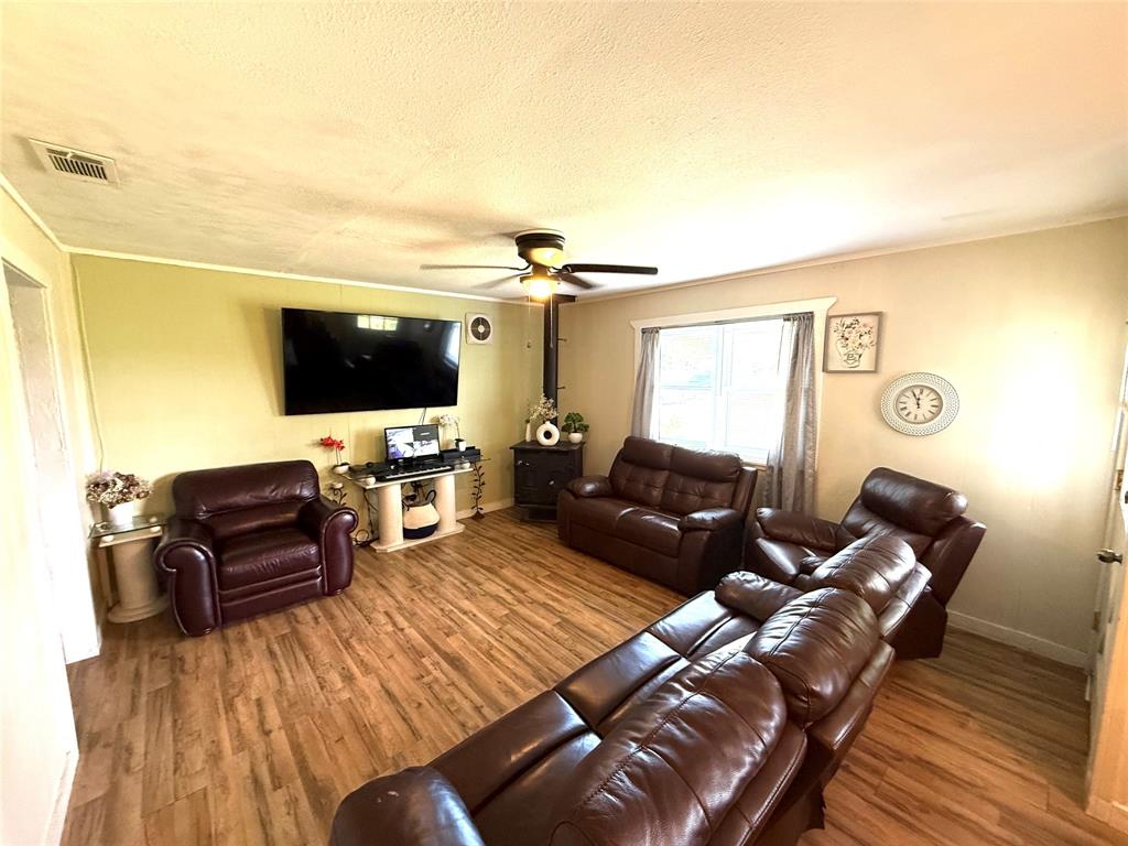 8384 West FM 545 Blue Ridge, TX 75424 - Photo 9 of 30 a living room with furniture and a flat screen tv