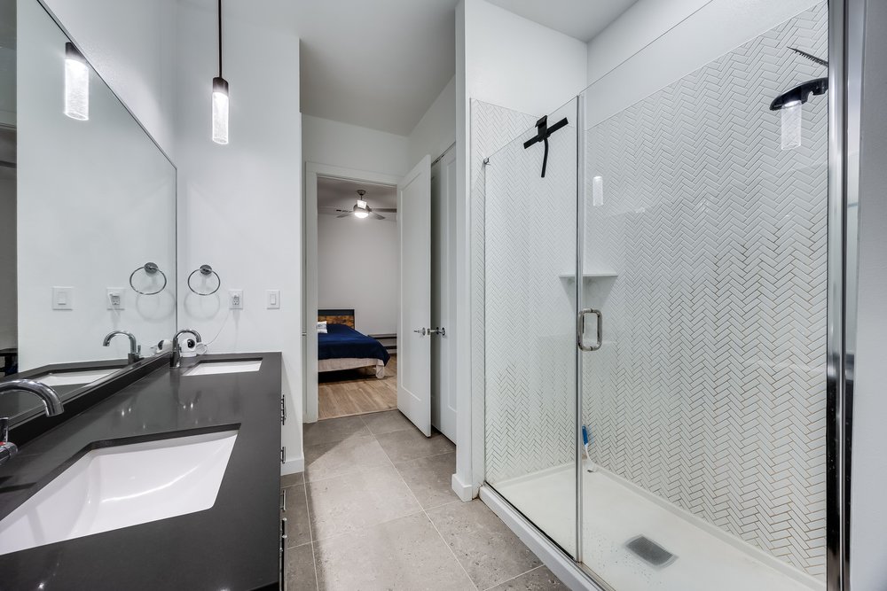 4801 Springdale Road, Unit 2107 Austin, TX 78723 - Photo 21 of 26 a view of a bathroom with tub shower and windows