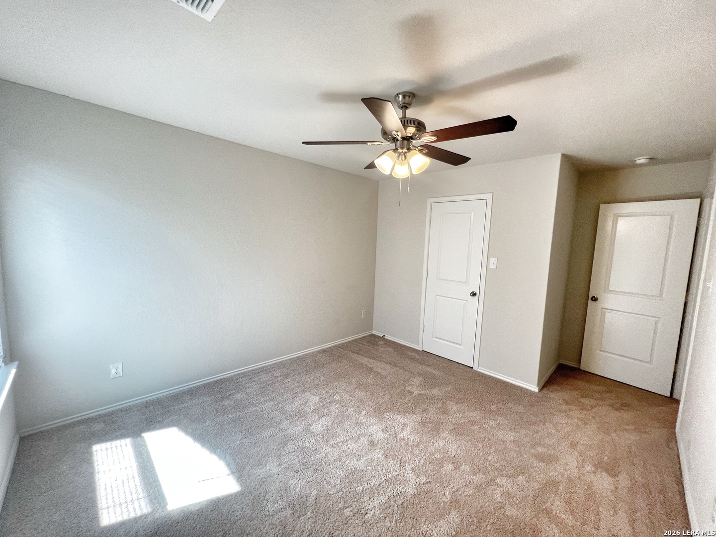 29529 Spring Copper Bulverde, TX 78163 - Photo 31 of 41 an empty room with a ceiling fan and a window