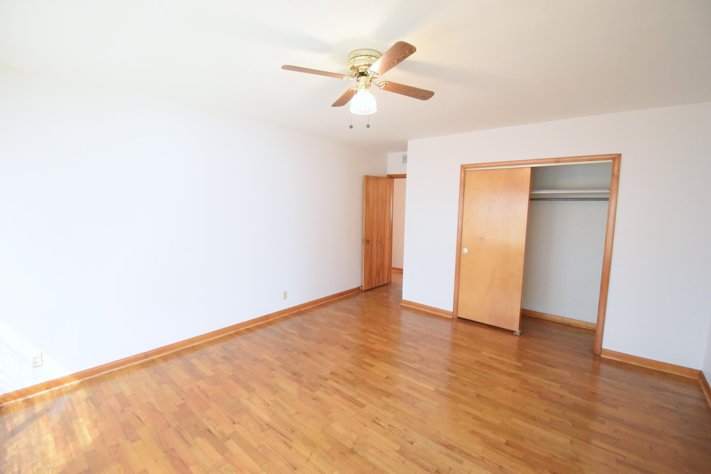 328 South Weston Street Rensselaer, IN 47978 - Photo 16 of 39 a view of an empty room with wooden floor