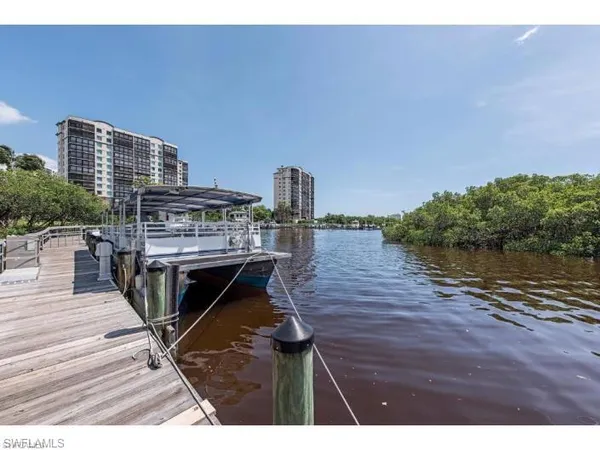 a view of a balcony with two chairs