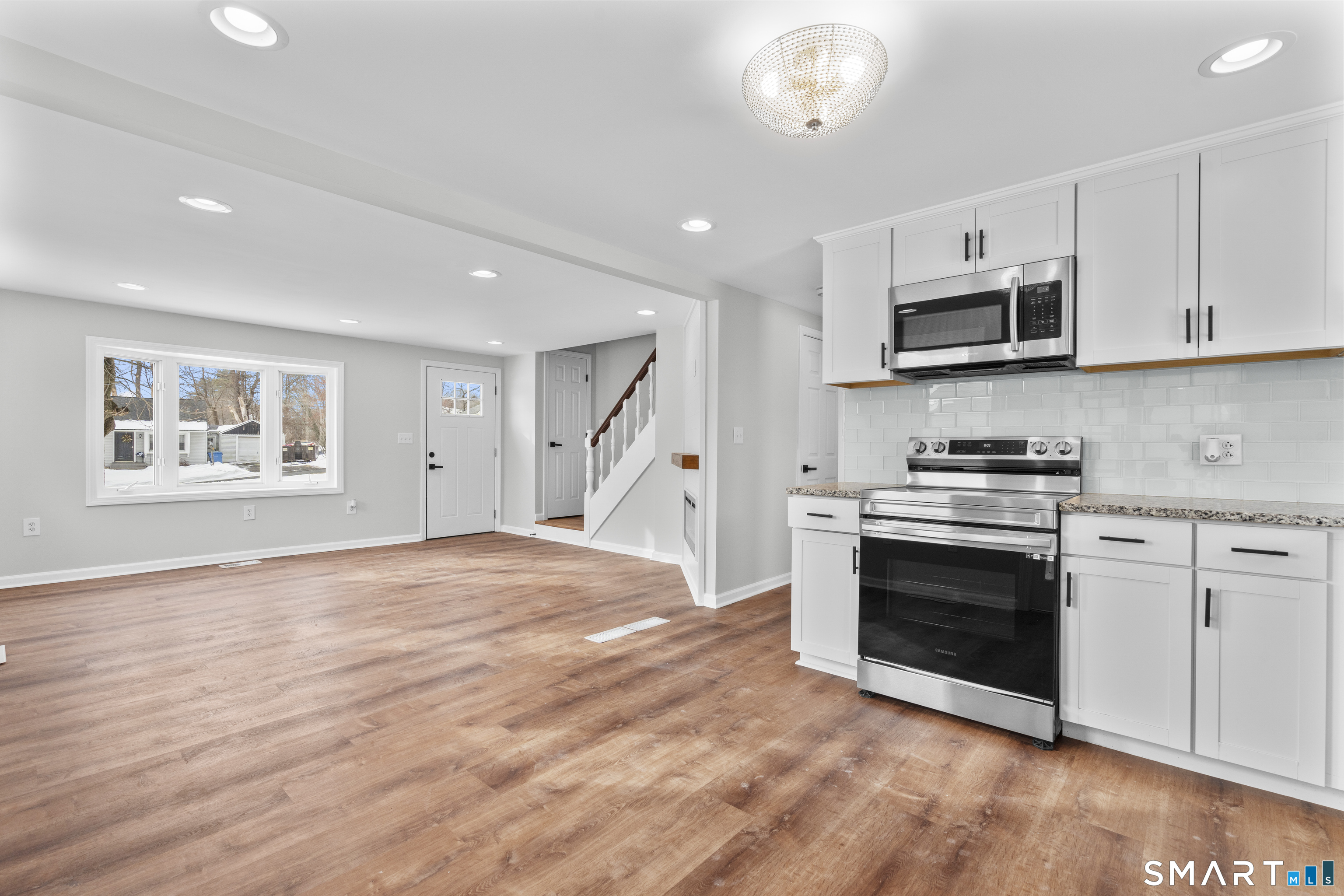 244 Curtiss Street Southington, CT 06489 - Photo 16 of 37 a kitchen with stainless steel appliances granite countertop a stove and a refrigerator