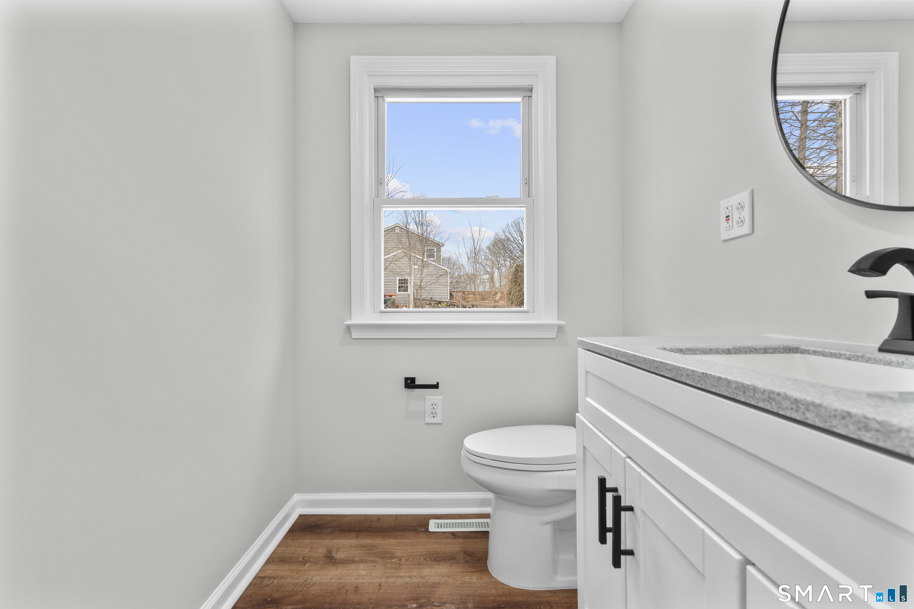 244 Curtiss Street Southington, CT 06489 - Photo 17 of 37 a bathroom with a toilet a sink and a mirror