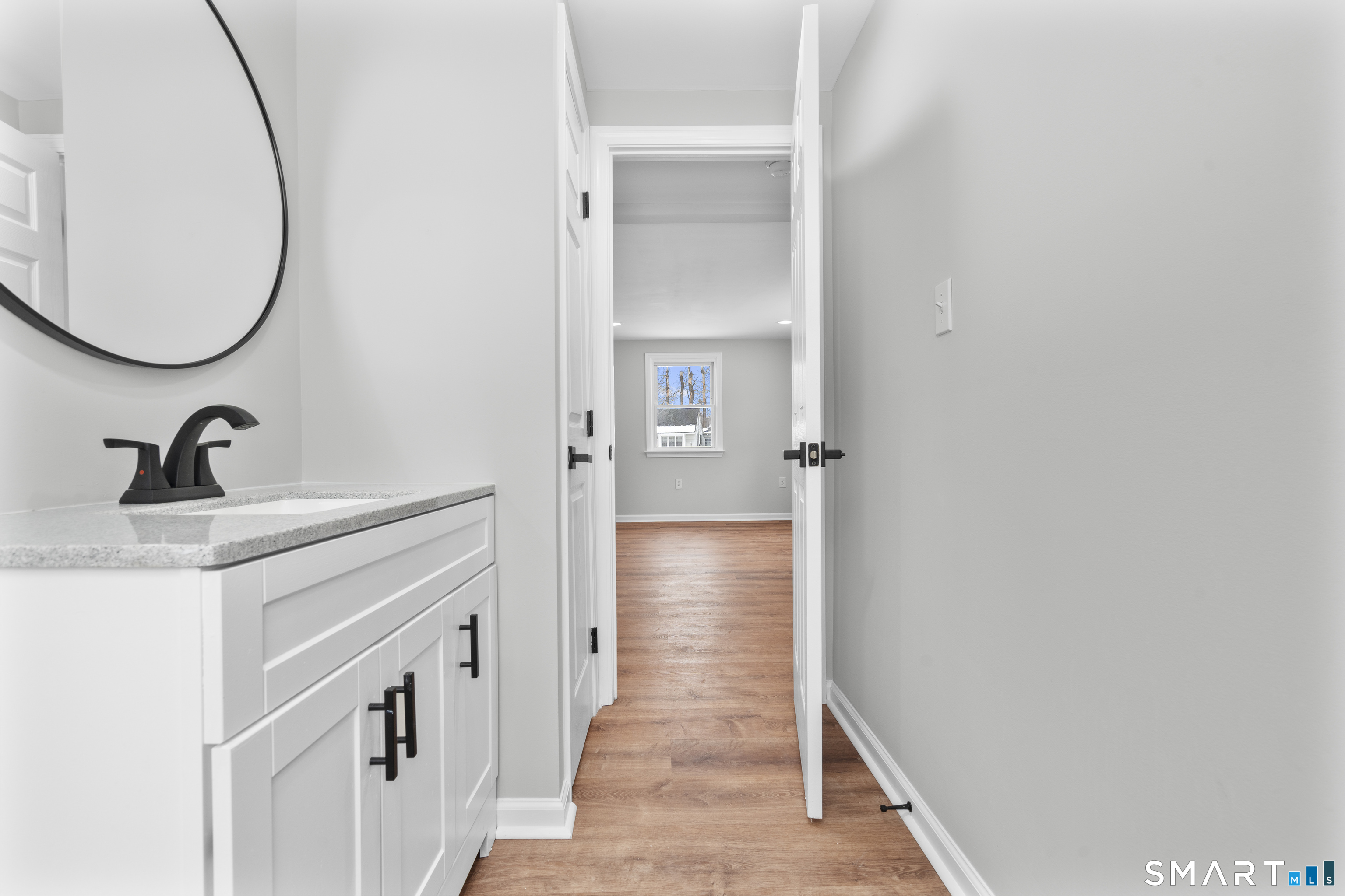 244 Curtiss Street Southington, CT 06489 - Photo 18 of 37 a bathroom with a sink and a mirror