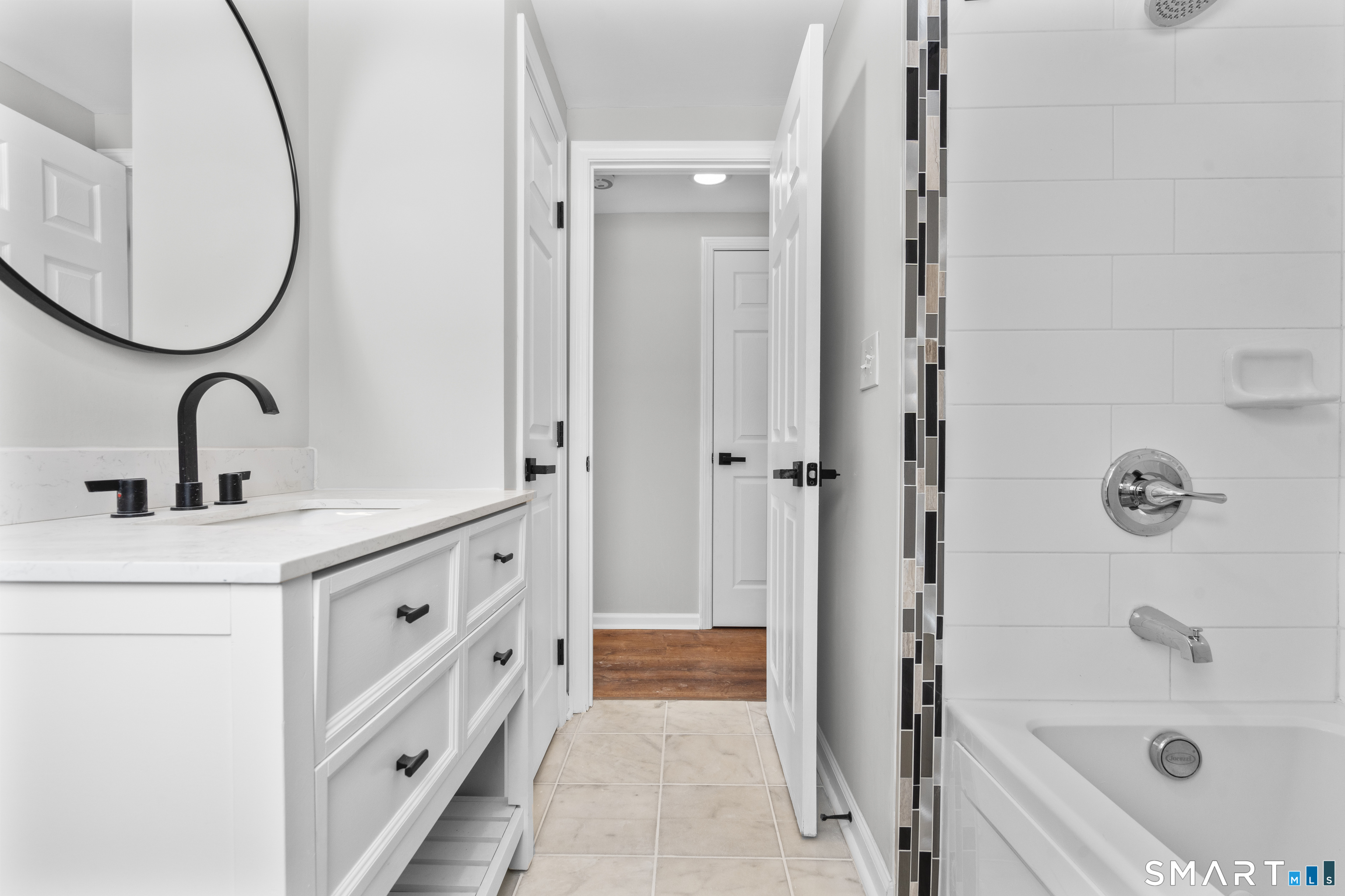 244 Curtiss Street Southington, CT 06489 - Photo 24 of 37 a bathroom with a tub sink and mirror