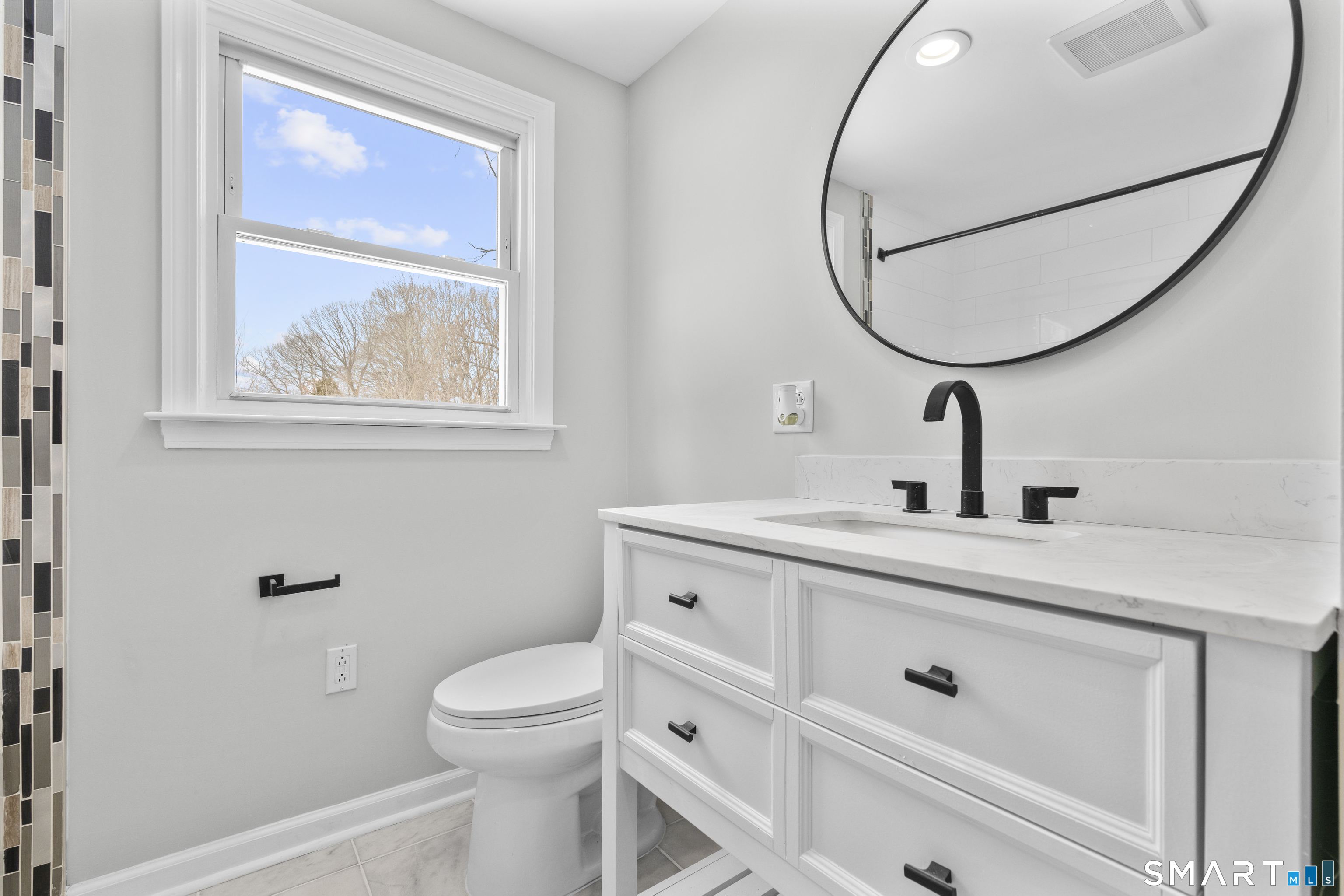 244 Curtiss Street Southington, CT 06489 - Photo 26 of 37 a bathroom with a toilet a sink and mirror