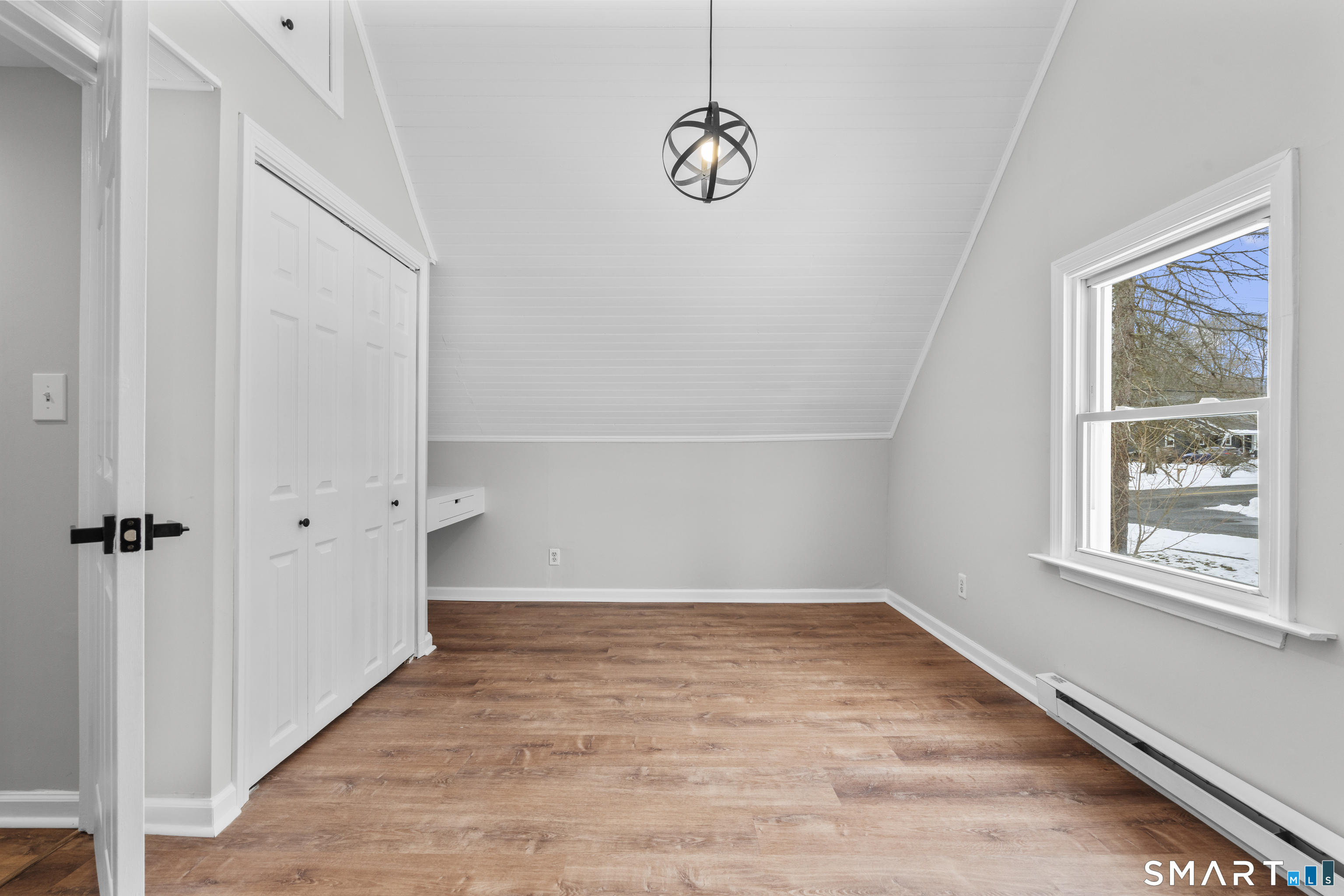 244 Curtiss Street Southington, CT 06489 - Photo 28 of 37 a view of an empty room with a window and wooden floor