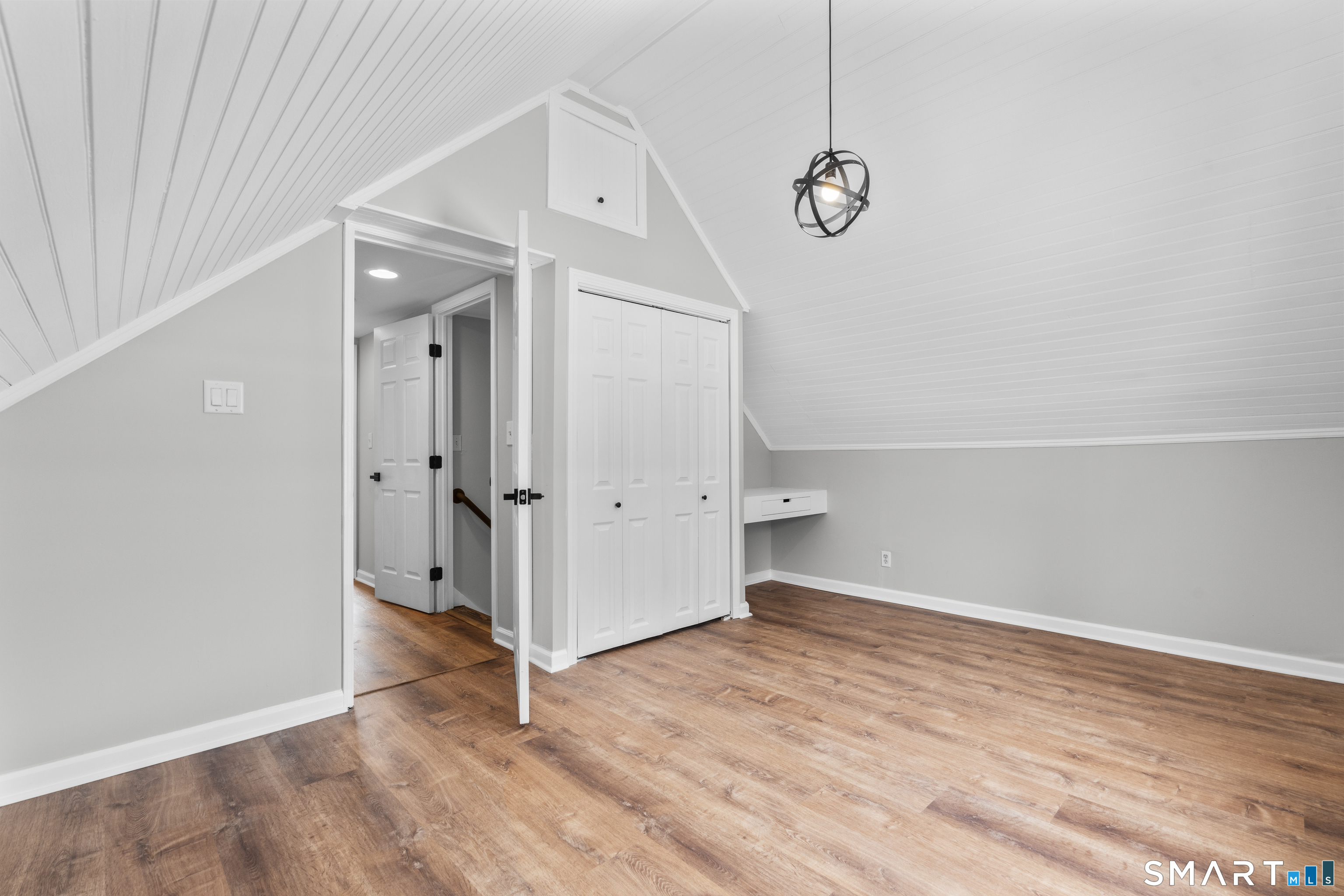 244 Curtiss Street Southington, CT 06489 - Photo 29 of 37 a view of a room with wooden floor and white walls