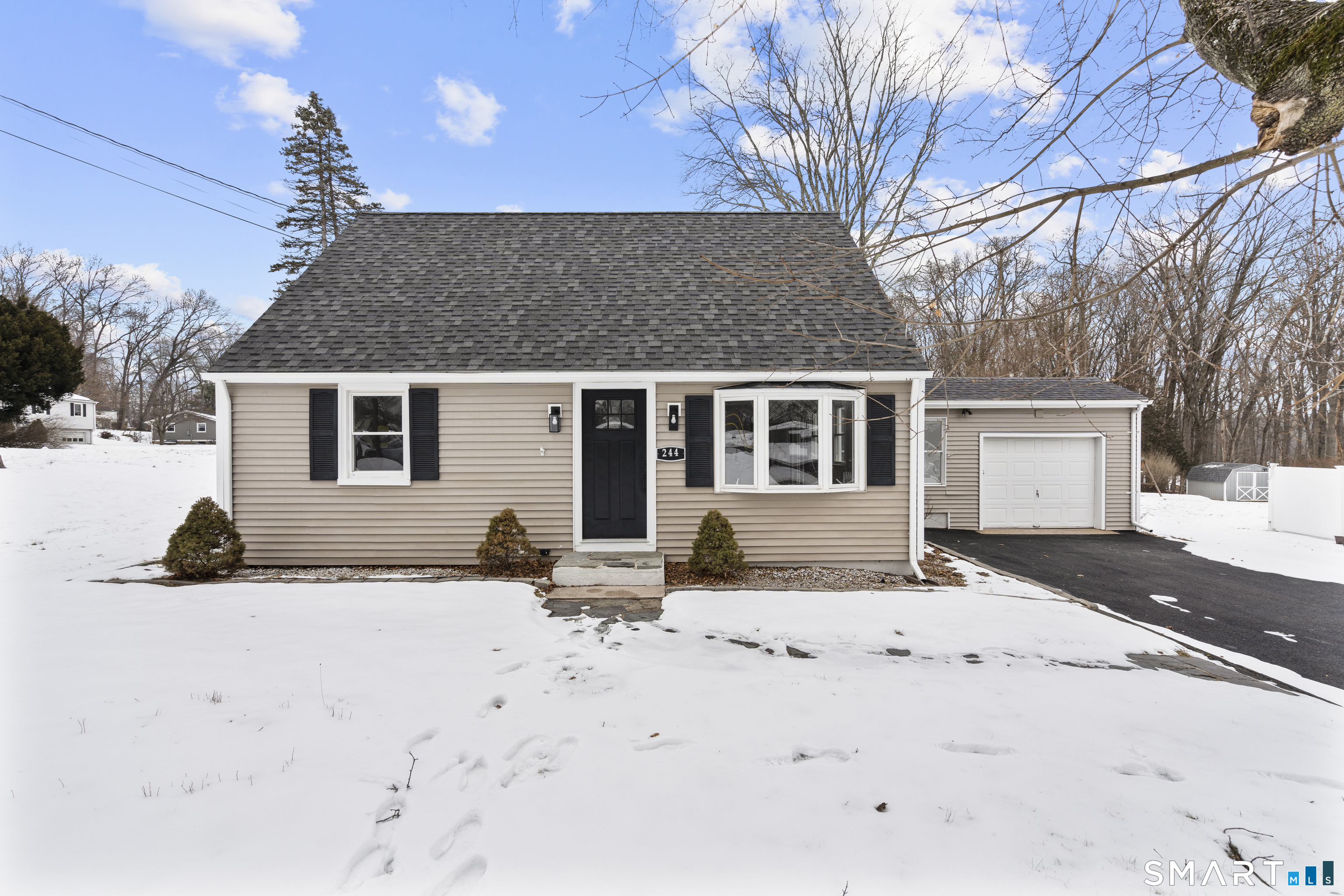 244 Curtiss Street Southington, CT 06489 - Photo 34 of 37 a view of a house with snow on the road