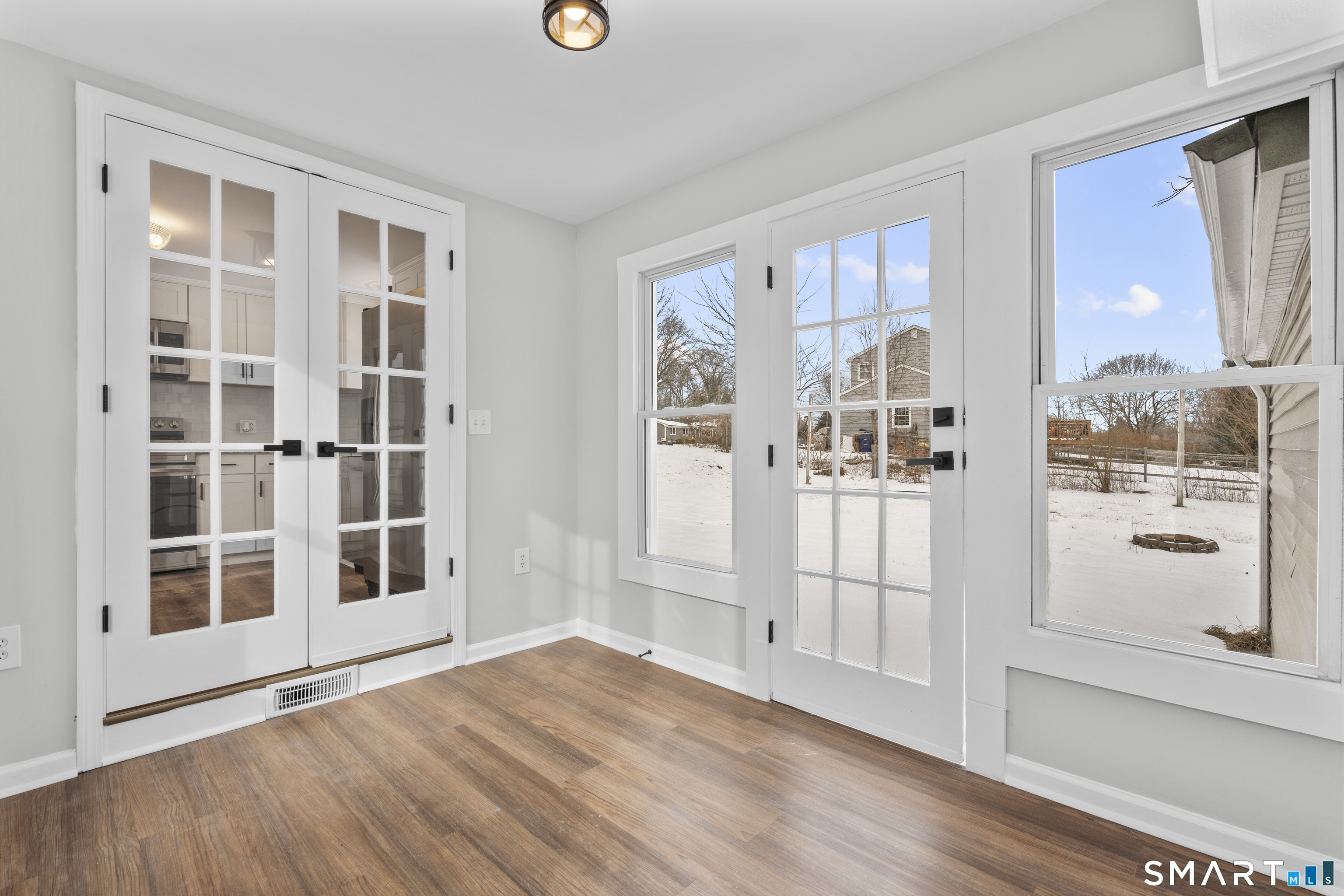 244 Curtiss Street Southington, CT 06489 - Photo 5 of 37 a view of empty room with wooden floor and windows
