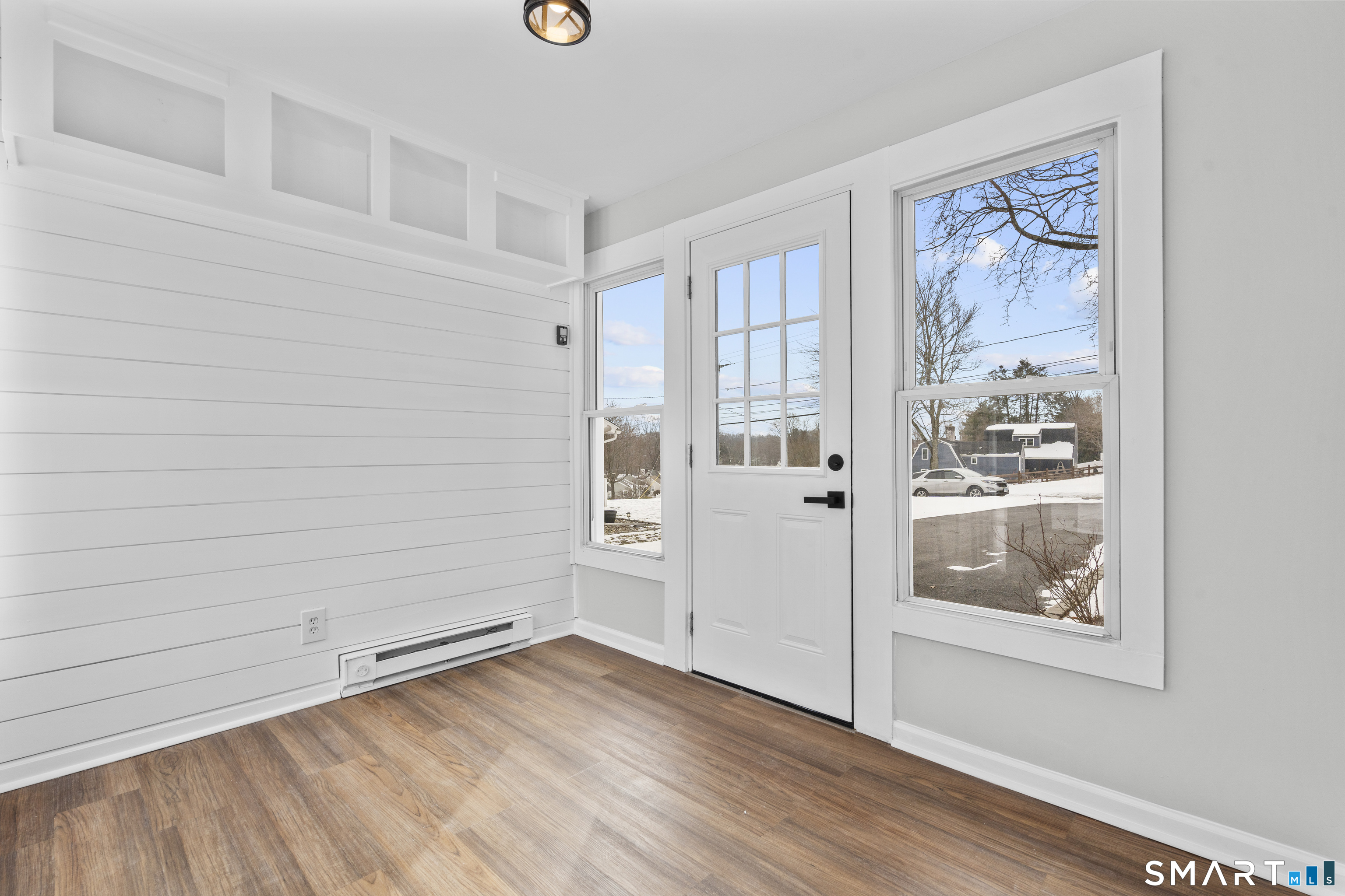244 Curtiss Street Southington, CT 06489 - Photo 6 of 37 a view of a small space with wooden floor and a window