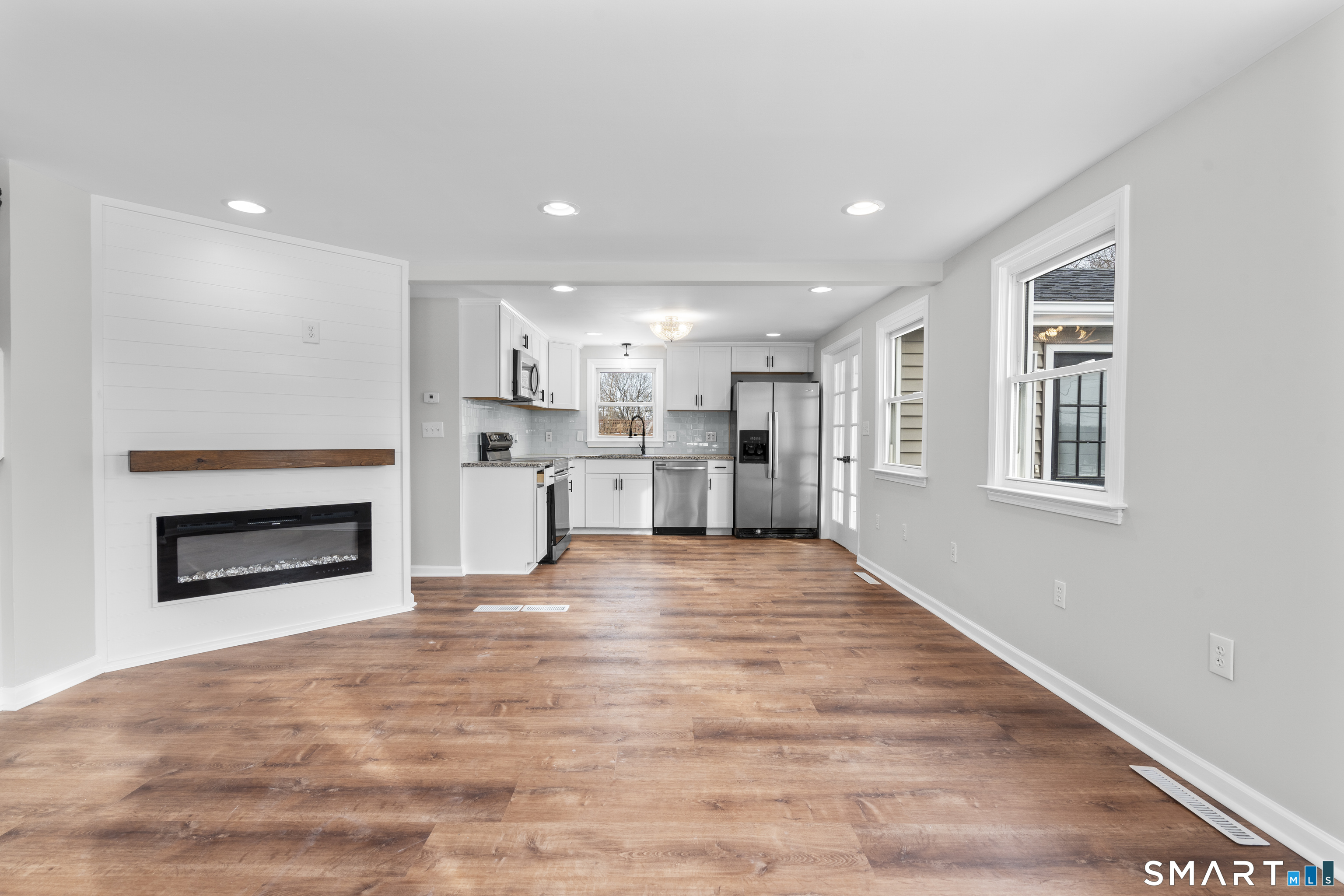 244 Curtiss Street Southington, CT 06489 - Photo 9 of 37 a view of a kitchen with a sink and a fireplace