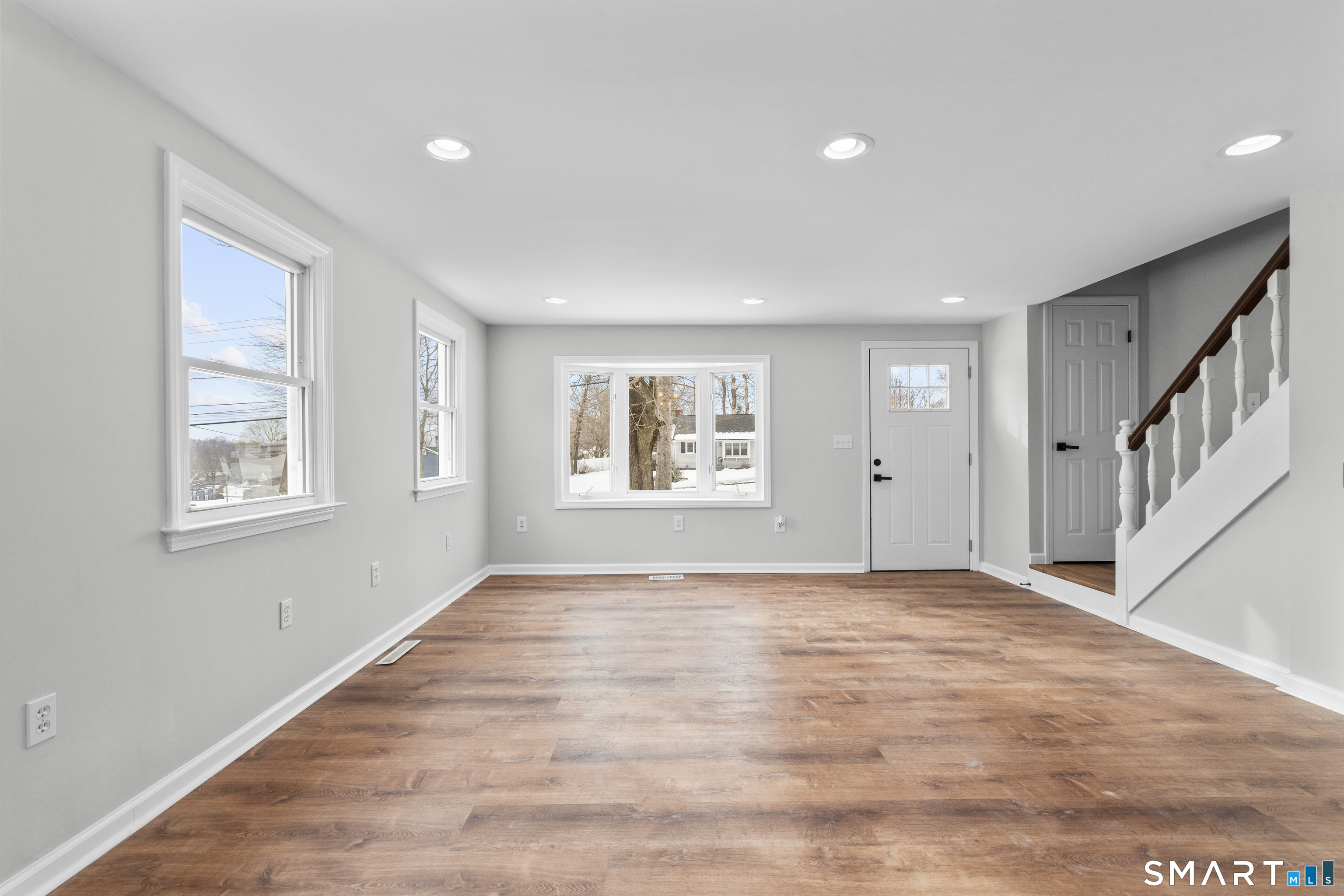 244 Curtiss Street Southington, CT 06489 - Photo 10 of 37 a view of an empty room with a window and wooden floor