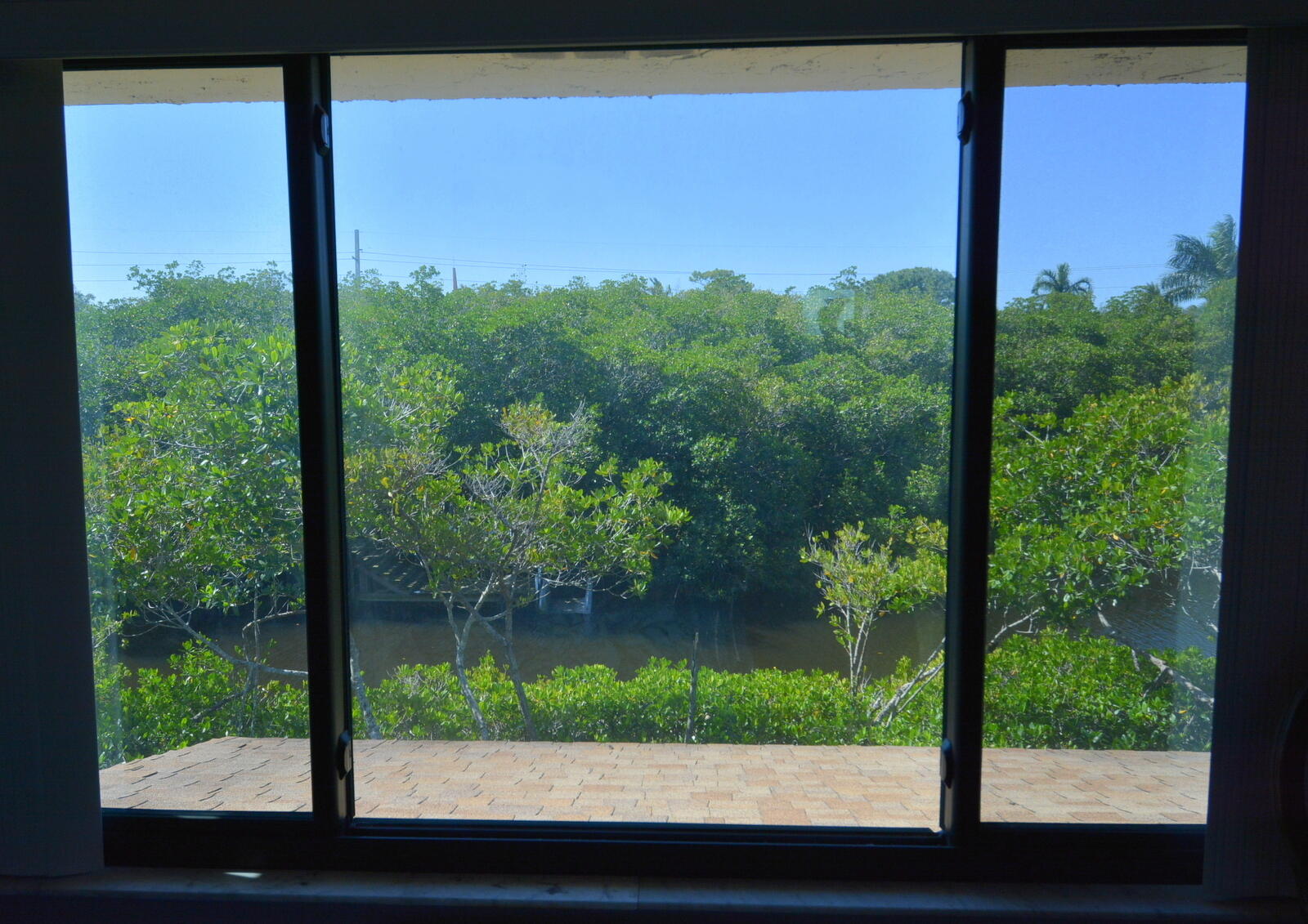 950 South Kanner Highway, Unit TH9 Stuart, FL 34994 - Photo 28 of 51 a view of a garden from a window