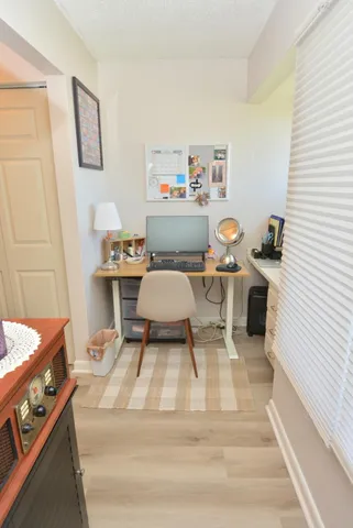 a workspace with furniture and window