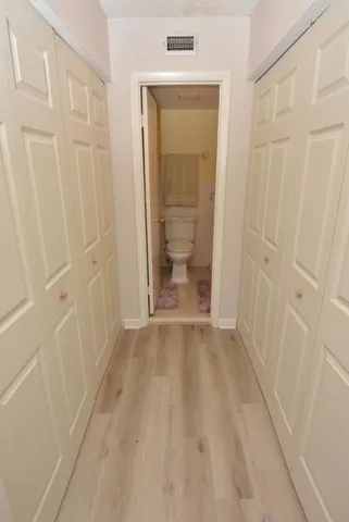 a white toilet sitting next to a bathroom sink