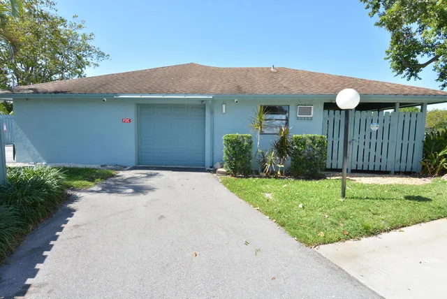 a view of a lake with a house in the background