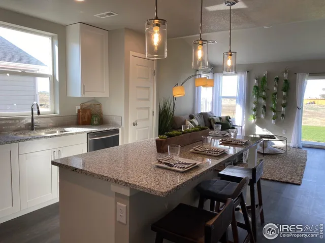 a kitchen with a table chairs stove and microwave
