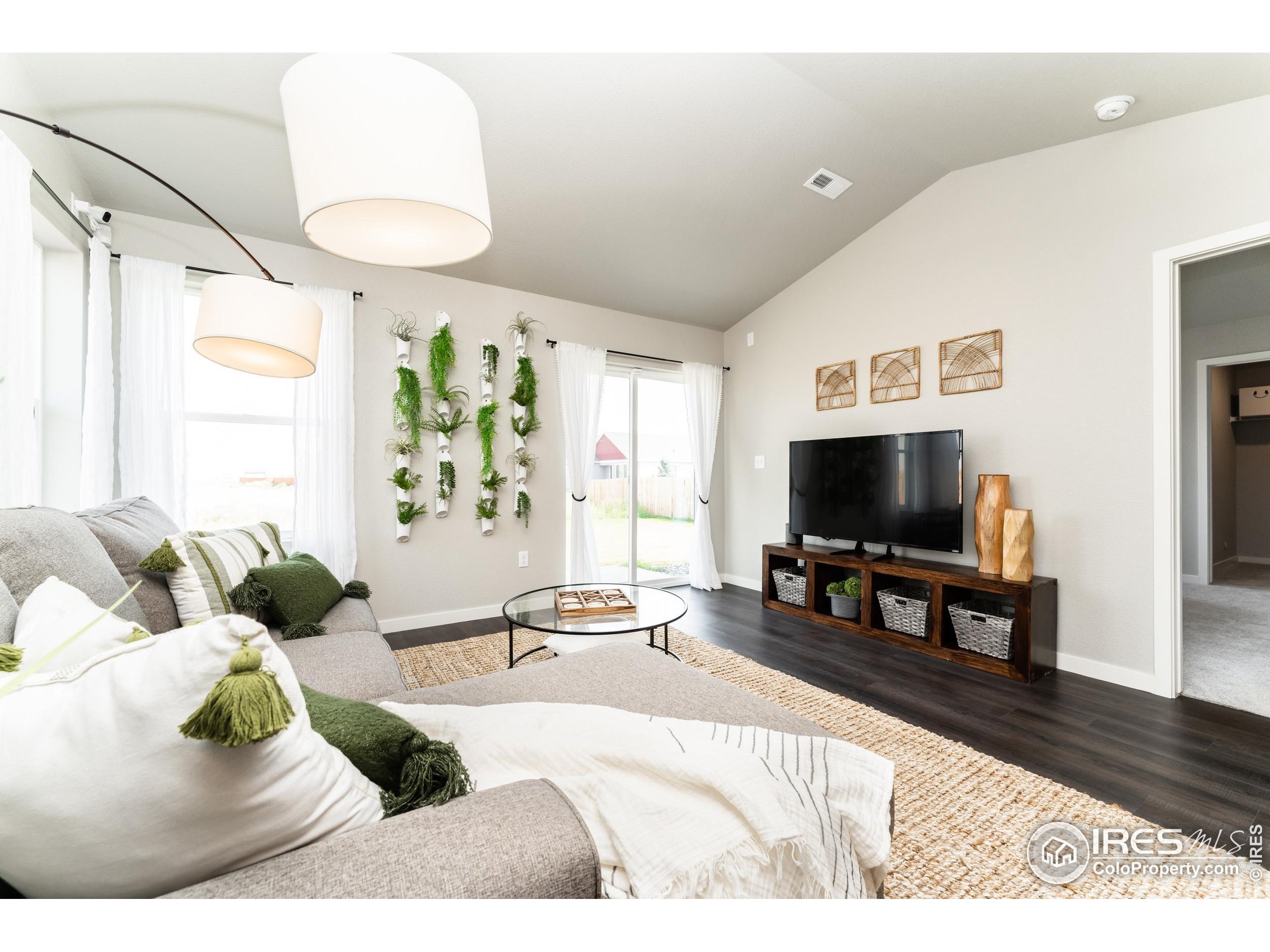 8535 West 5th Street Greeley, CO 80634 - Photo 6 of 12 a living room with furniture and a flat screen tv