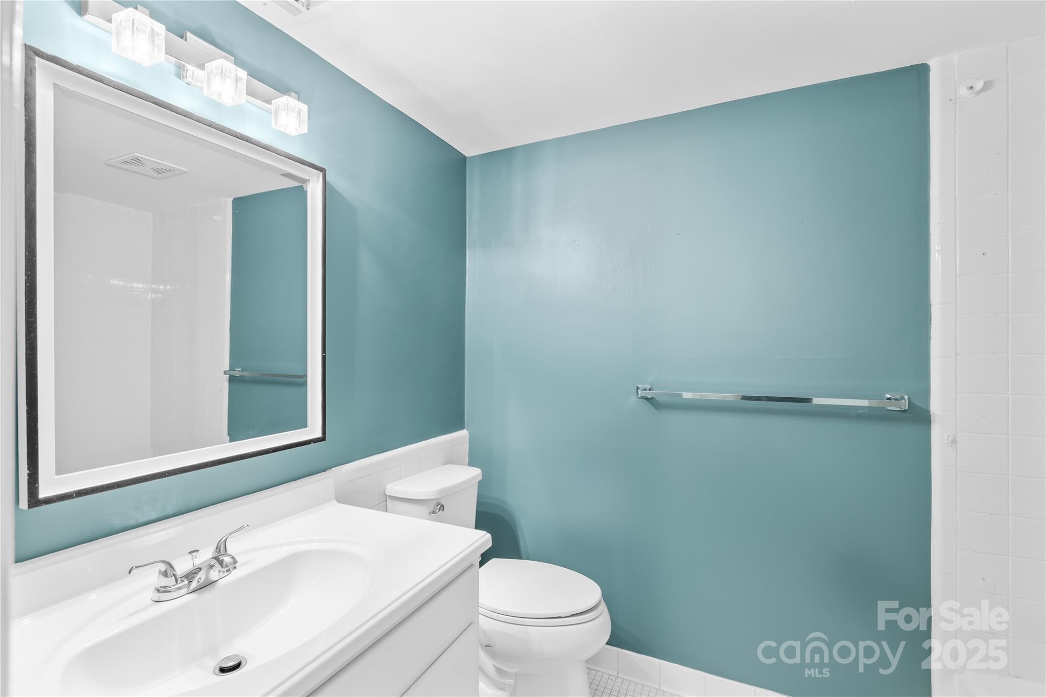 4754 Hedgemore Drive, Unit P Charlotte, NC 28209 - Photo 13 of 19 a bathroom with a sink a toilet and shower