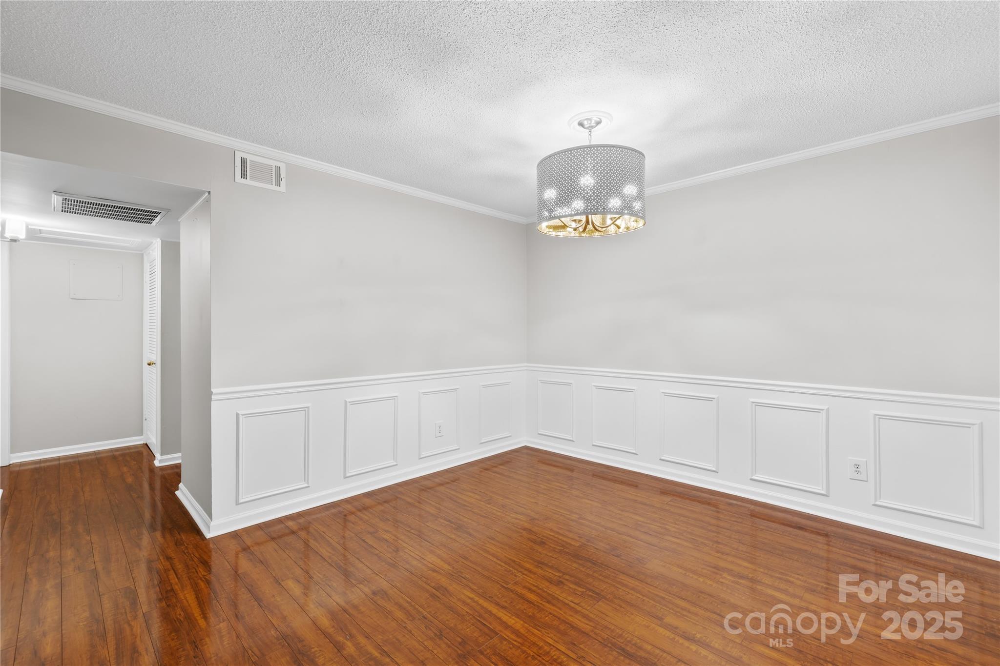 4754 Hedgemore Drive, Unit P Charlotte, NC 28209 - Photo 3 of 19 a view of an empty room with wooden floor