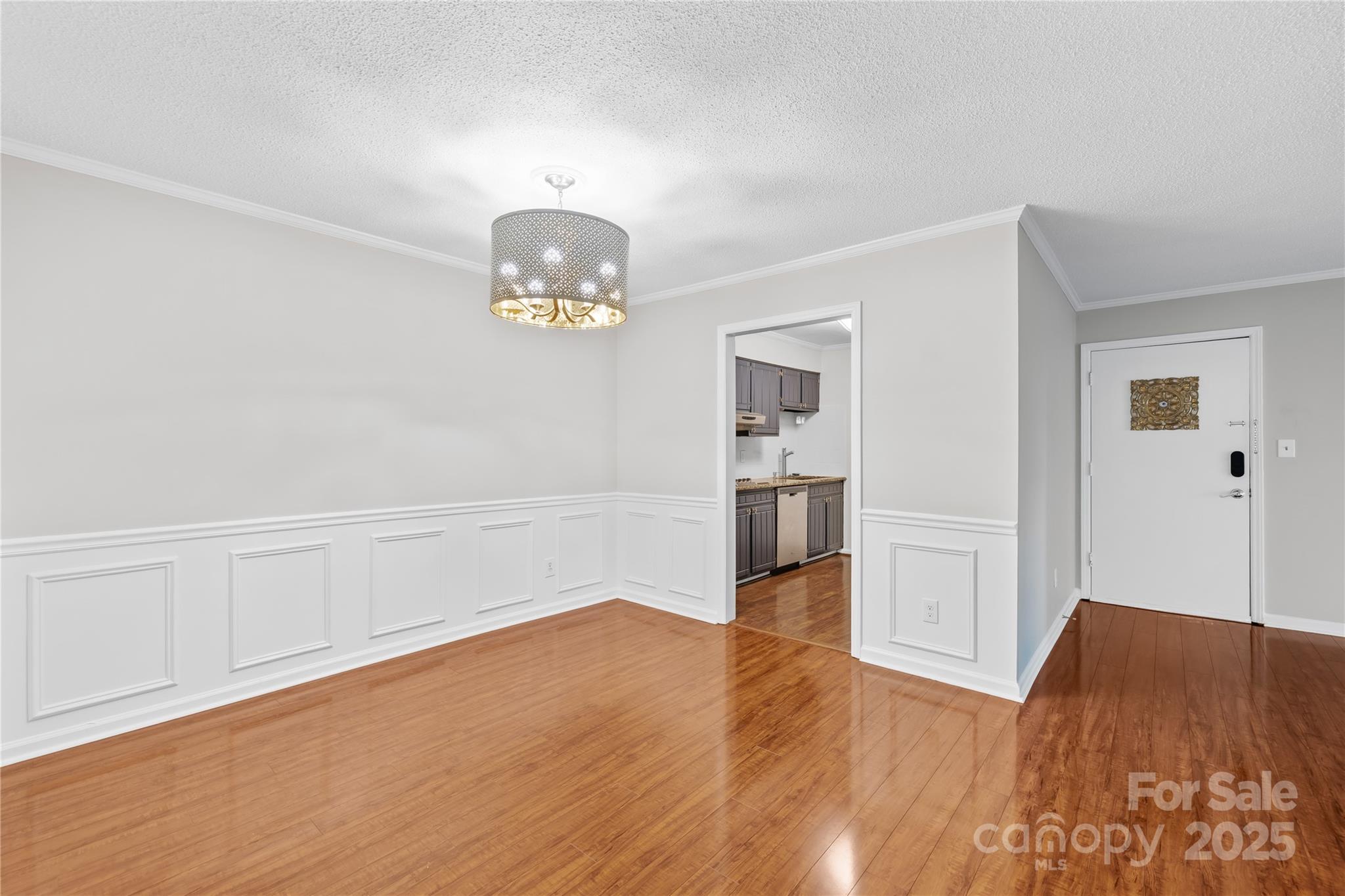 4754 Hedgemore Drive, Unit P Charlotte, NC 28209 - Photo 4 of 19 a view of empty room with wooden floor