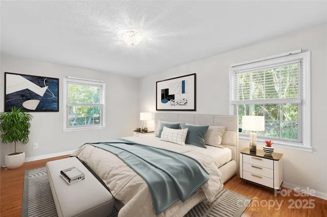 a bedroom with a large bed and a window