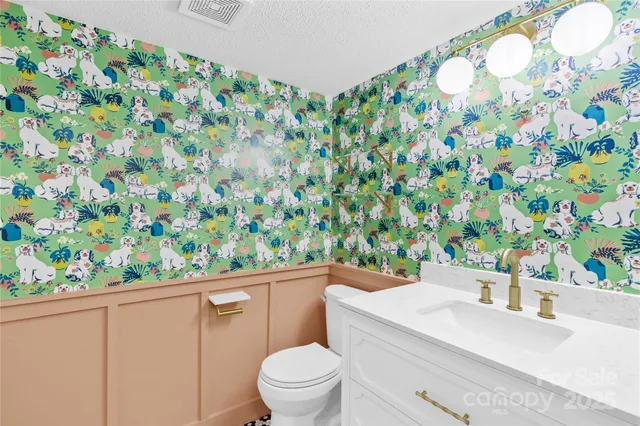 a bathroom with a toilet and a sink