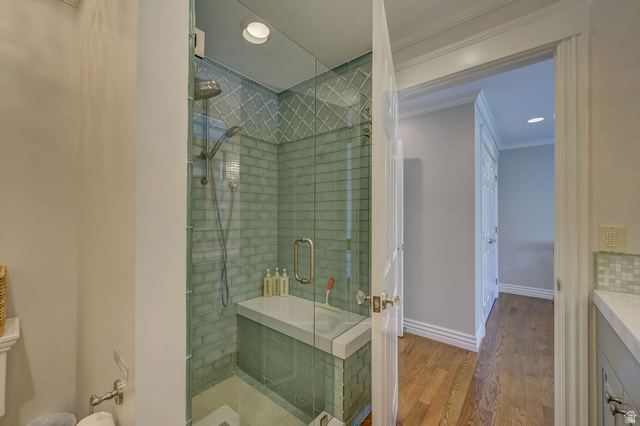 9699 Bypass Road, Unit 5 Alta, UT 84092 - Photo 39 of 54 Glass-enclosed shower featuring subway tile with decorative mosaic accents and an integrated bench