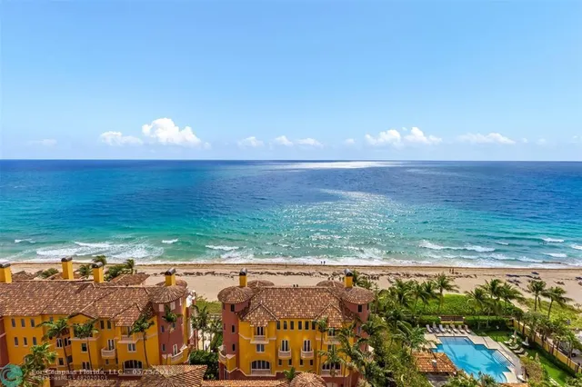 a living room with fireplace furniture and a large window
