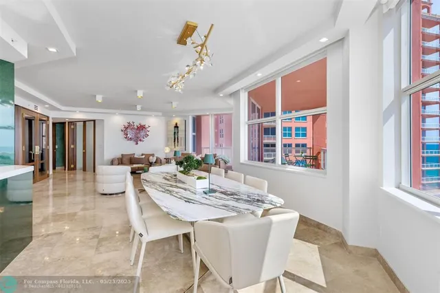 a view of a kitchen with a sink and a large window